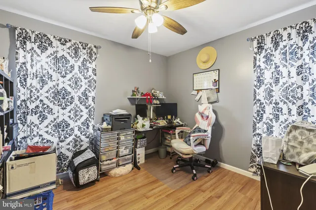 a workspace with furniture and wooden floor