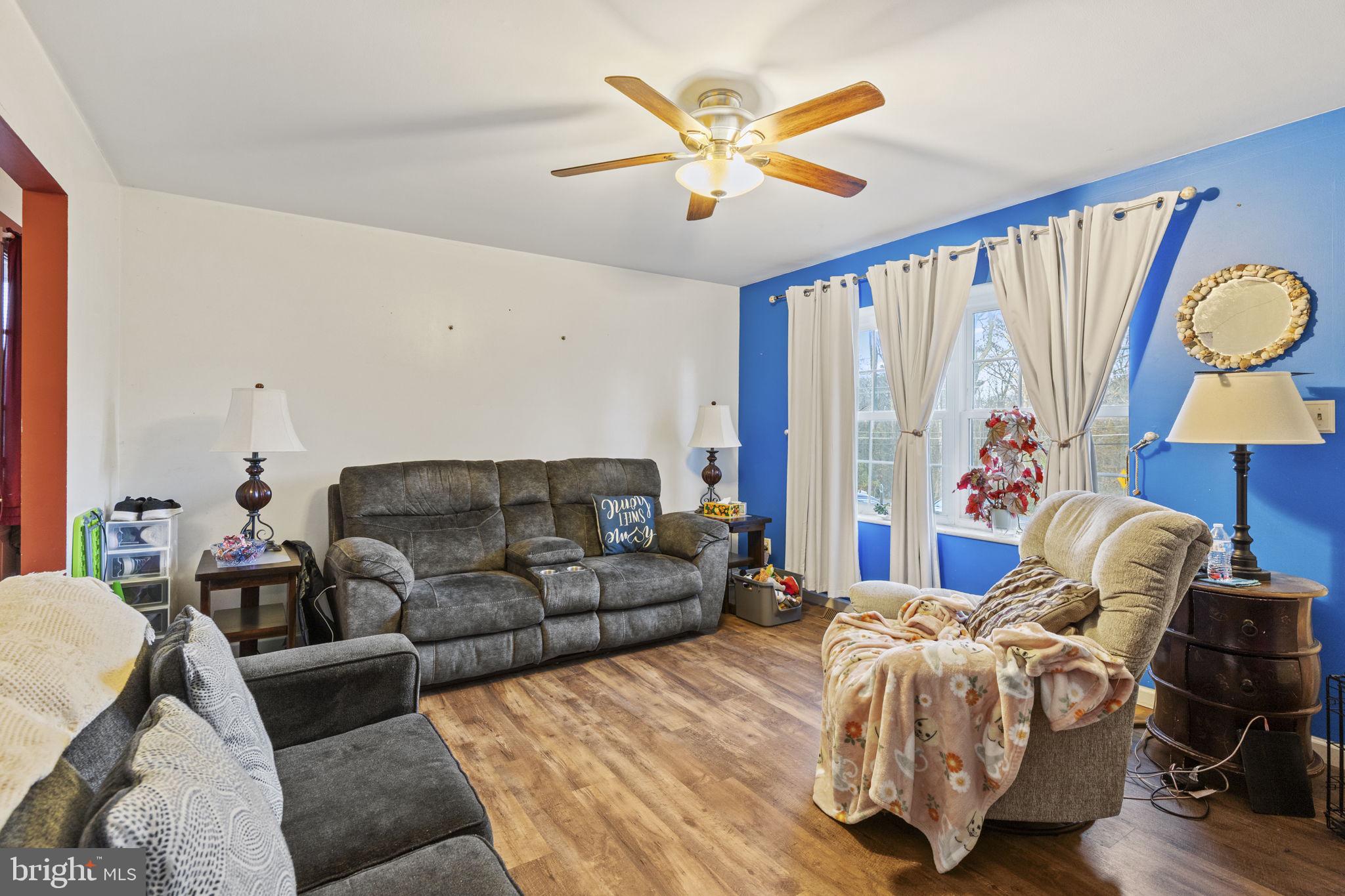 420 Jackson Park Road Port Deposit, MD 21904 - Photo 4 of 17 a living room with a bed furniture and a large window