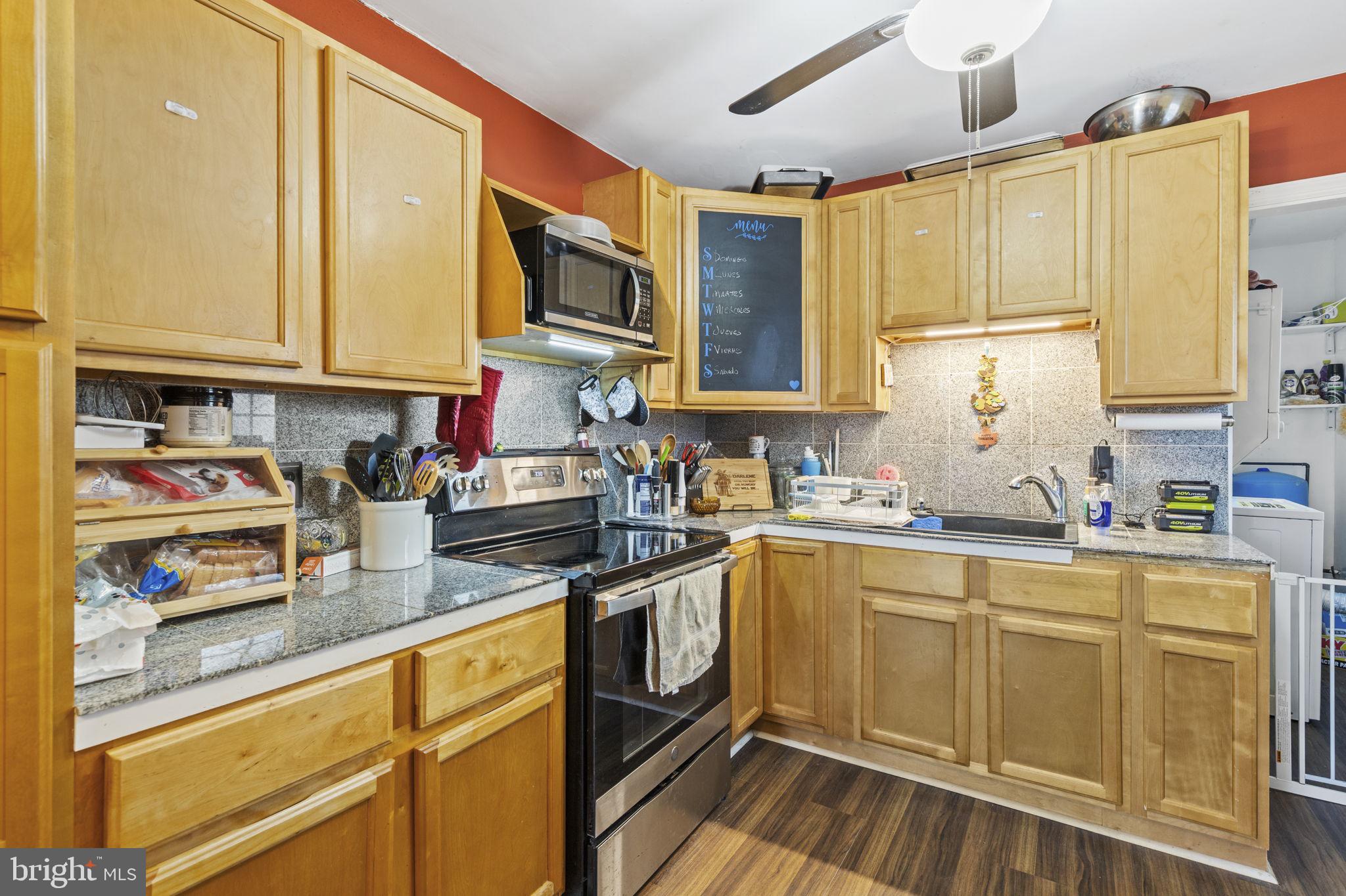420 Jackson Park Road Port Deposit, MD 21904 - Photo 7 of 17 a kitchen with granite countertop a sink stainless steel appliances and cabinets