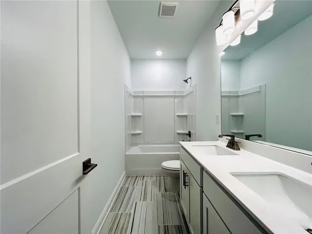a bathroom with a sink a vanity and a mirror