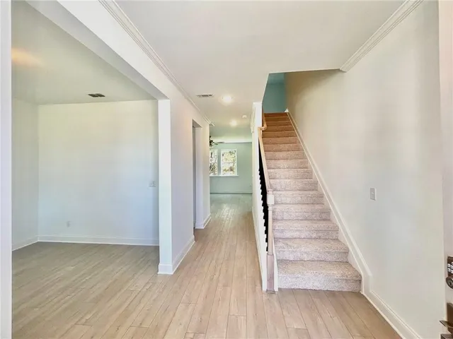 a view of entryway with wooden floor