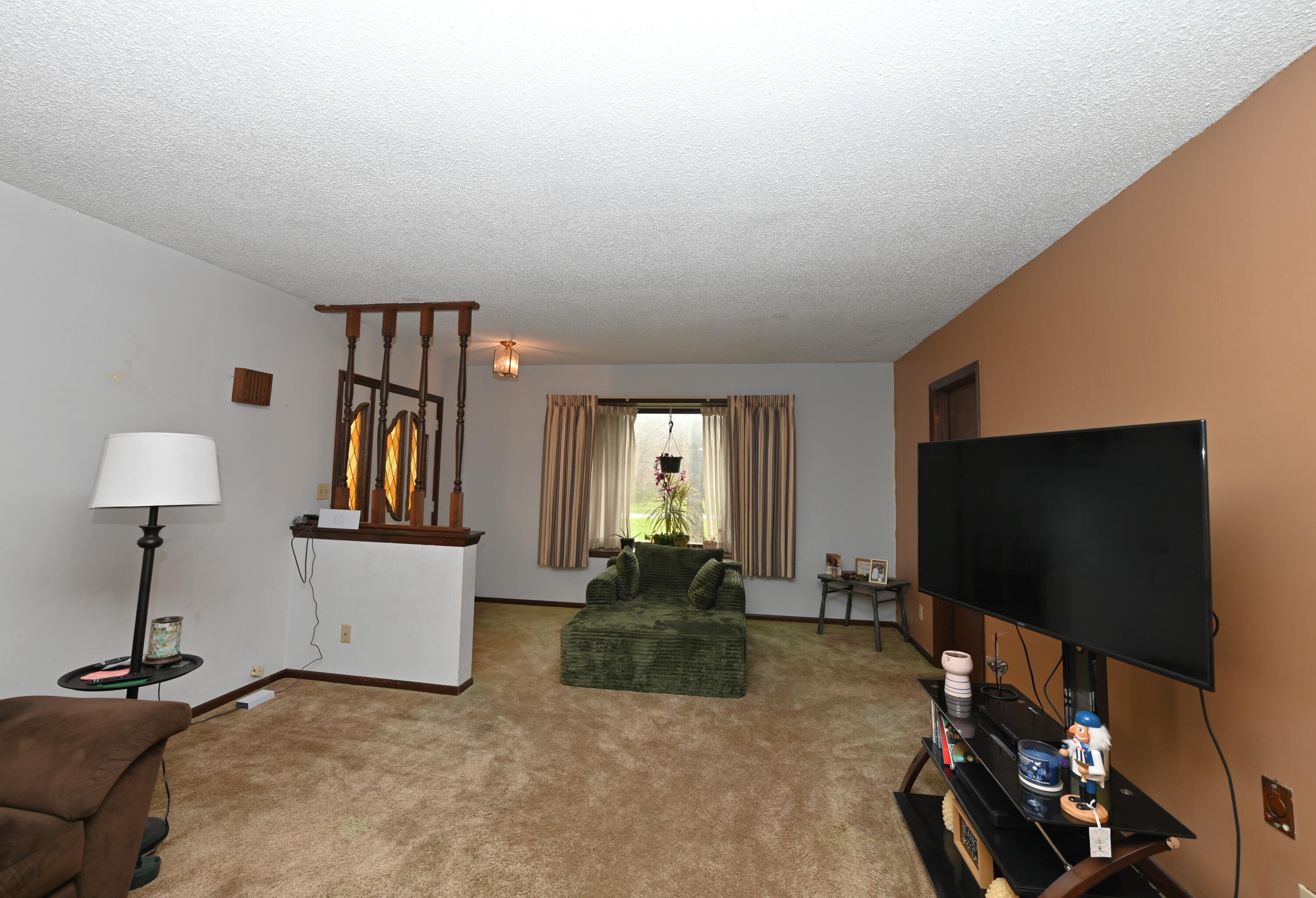 5110 West 400 North Winamac, IN 46996 - Photo 17 of 35 a living room with furniture and a flat screen tv