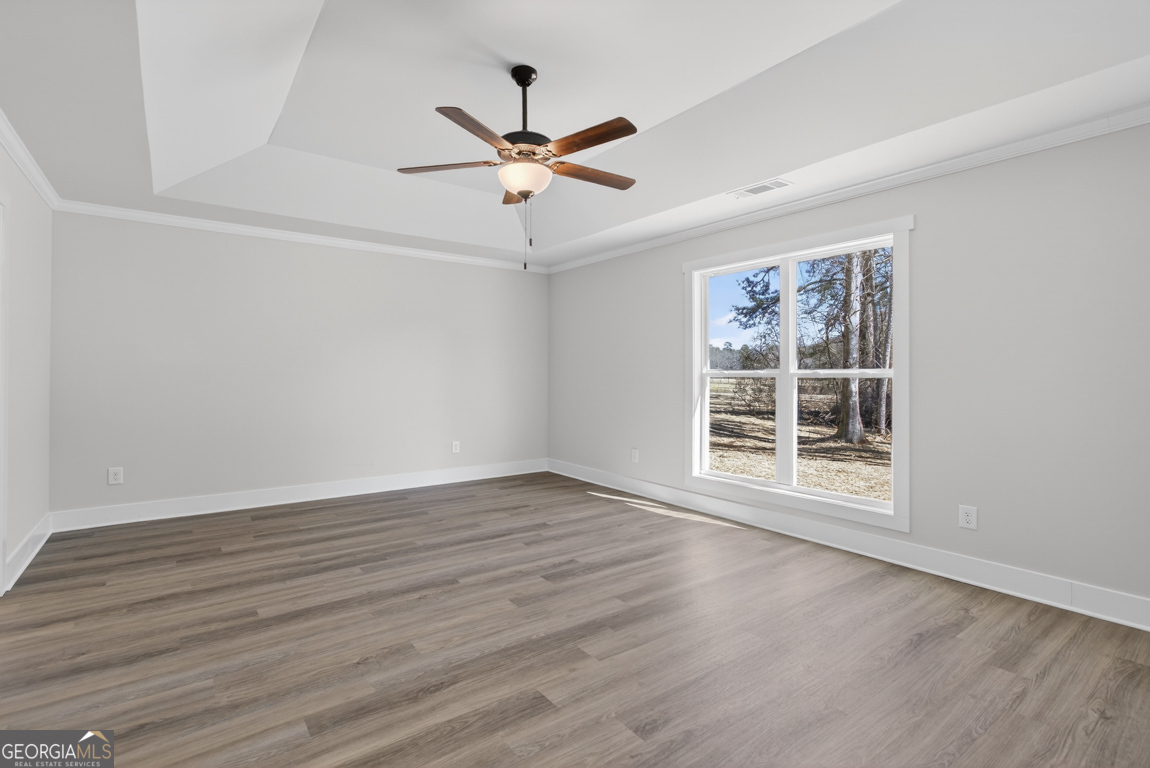 302 Mockingbird Lane, Unit 25 Winder, GA 30680 - Photo 28 of 38 wooden floor in an empty room with a window