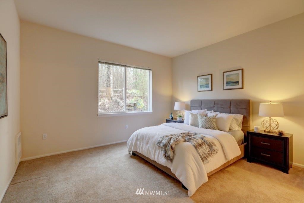 4818 Davis Place South Renton, WA 98055 - Photo 8 of 14 a bed room with a bed and a window