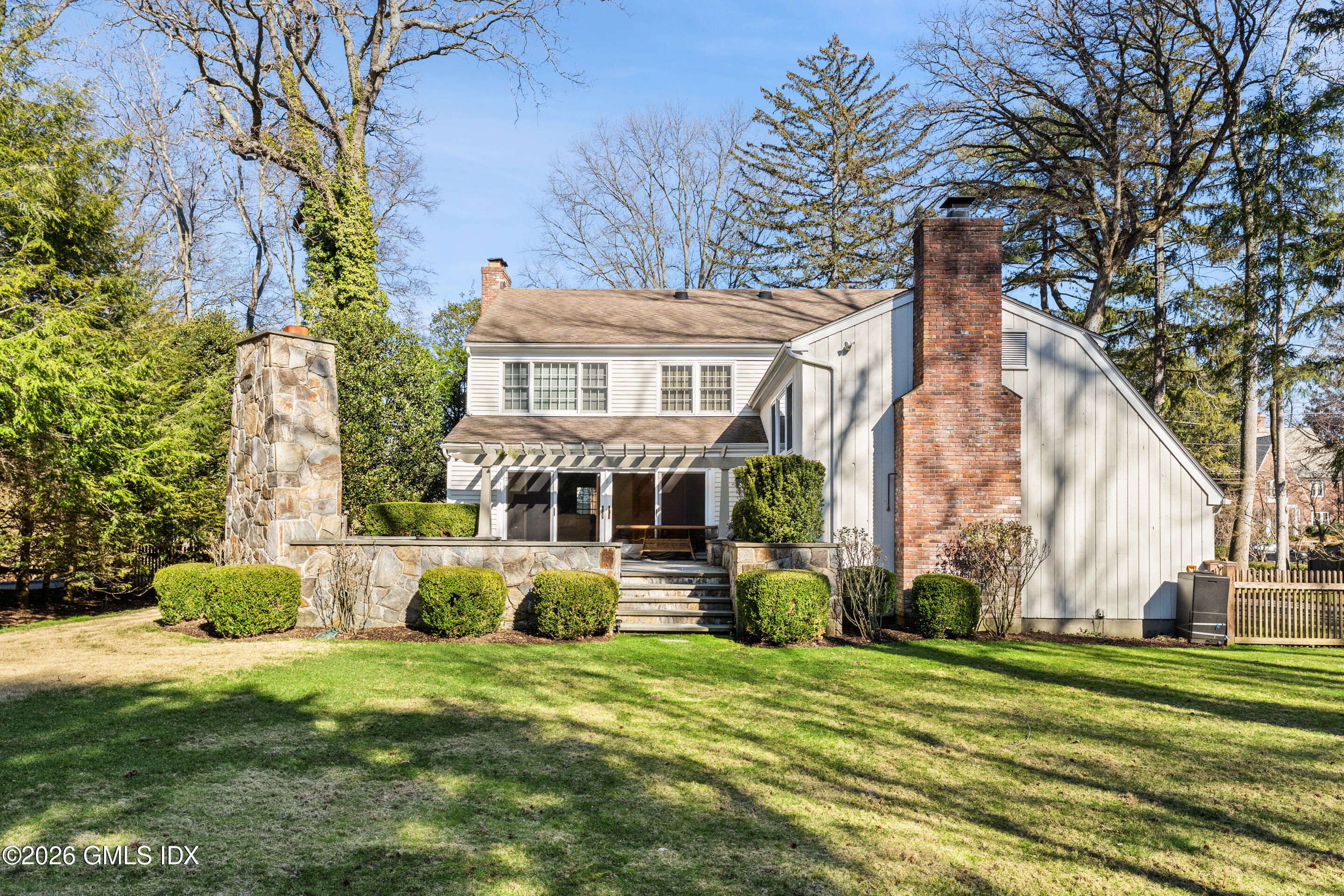 78 Meadow Road Riverside, CT 06878 - Photo 13 of 17 a front view of a house with a garden