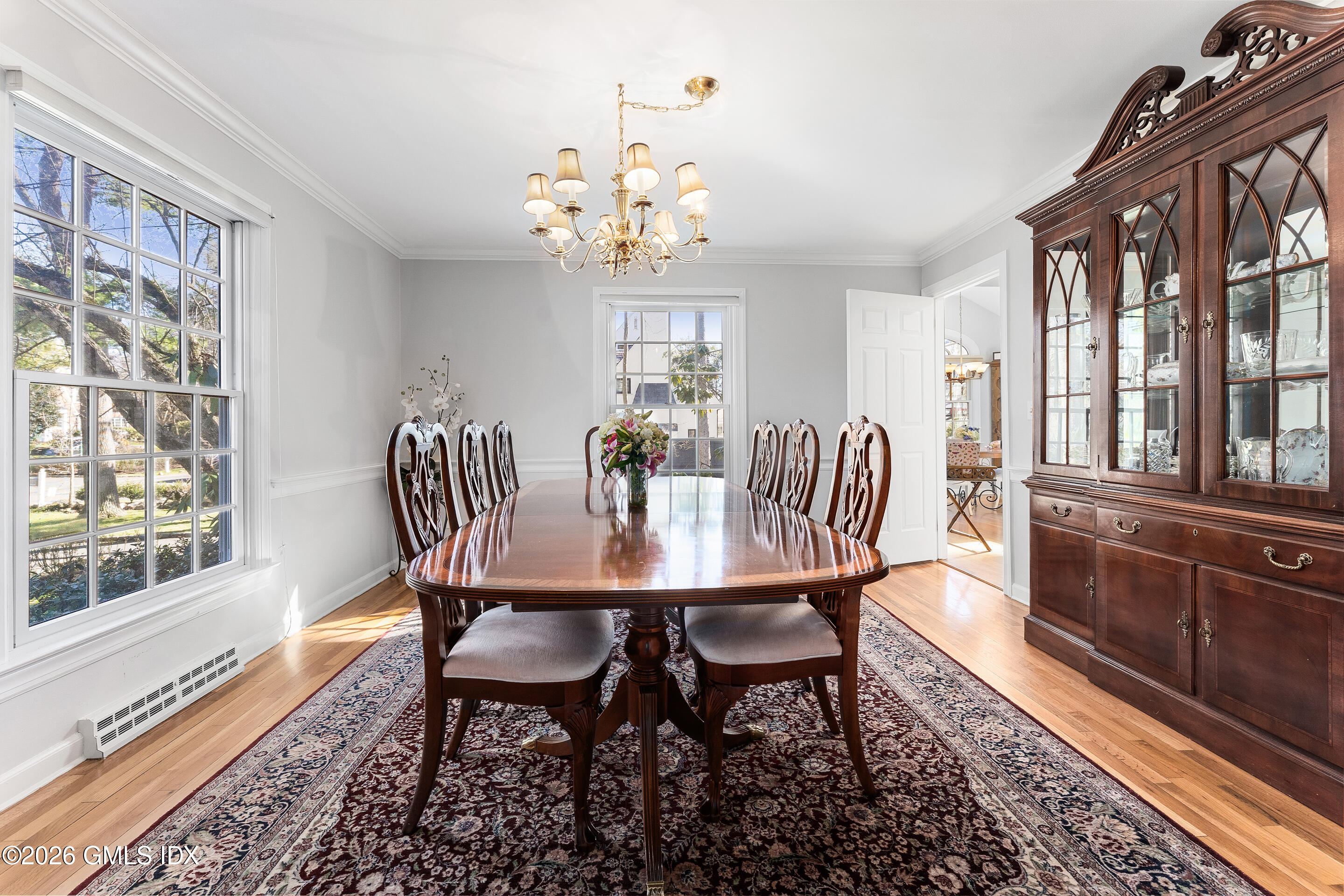 78 Meadow Road Riverside, CT 06878 - Photo 4 of 17 a view of a dining room with furniture a rug and wooden floor