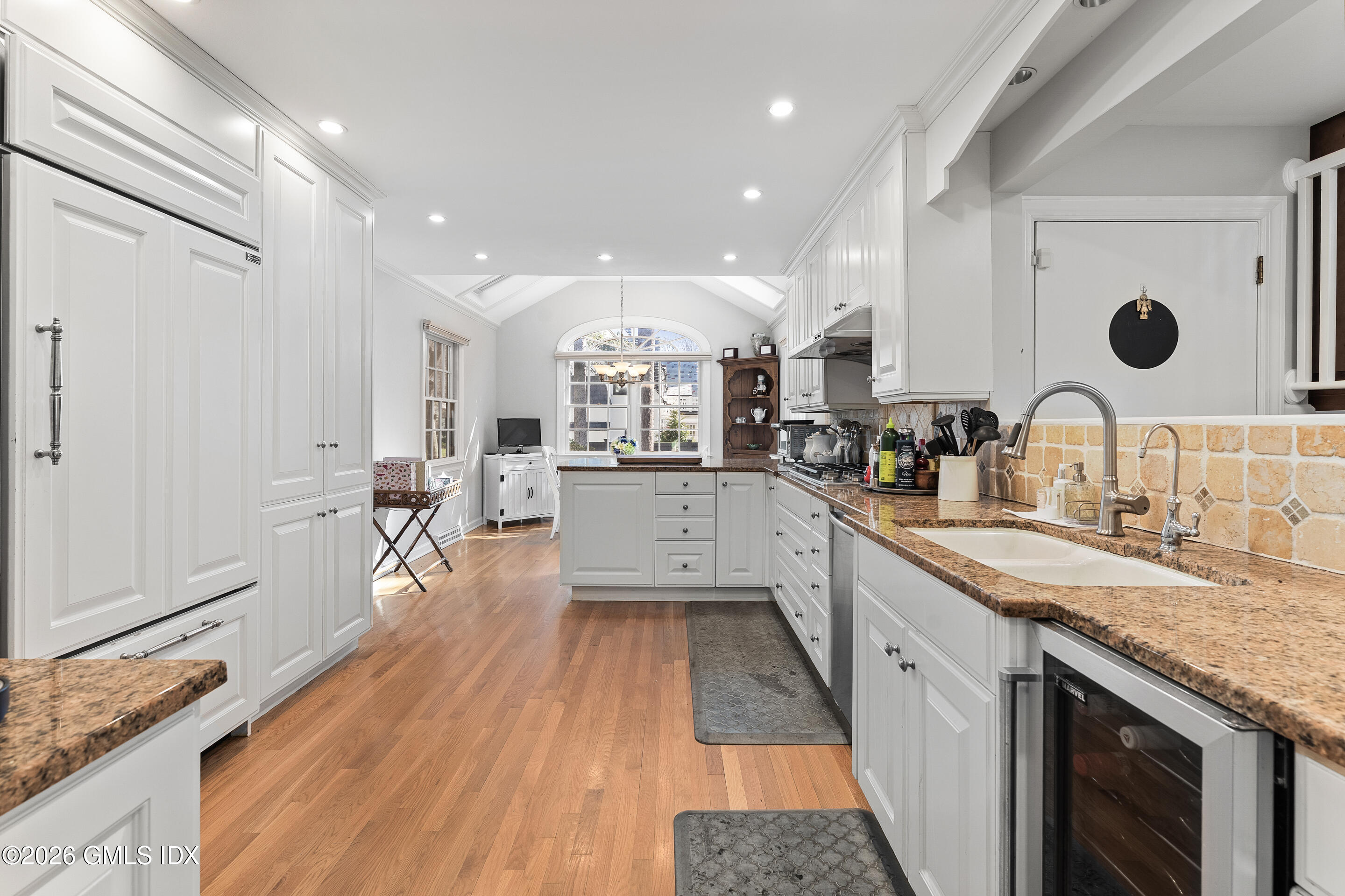 78 Meadow Road Riverside, CT 06878 - Photo 6 of 17 a large kitchen with stainless steel appliances granite countertop a lot of counter space and wooden floor