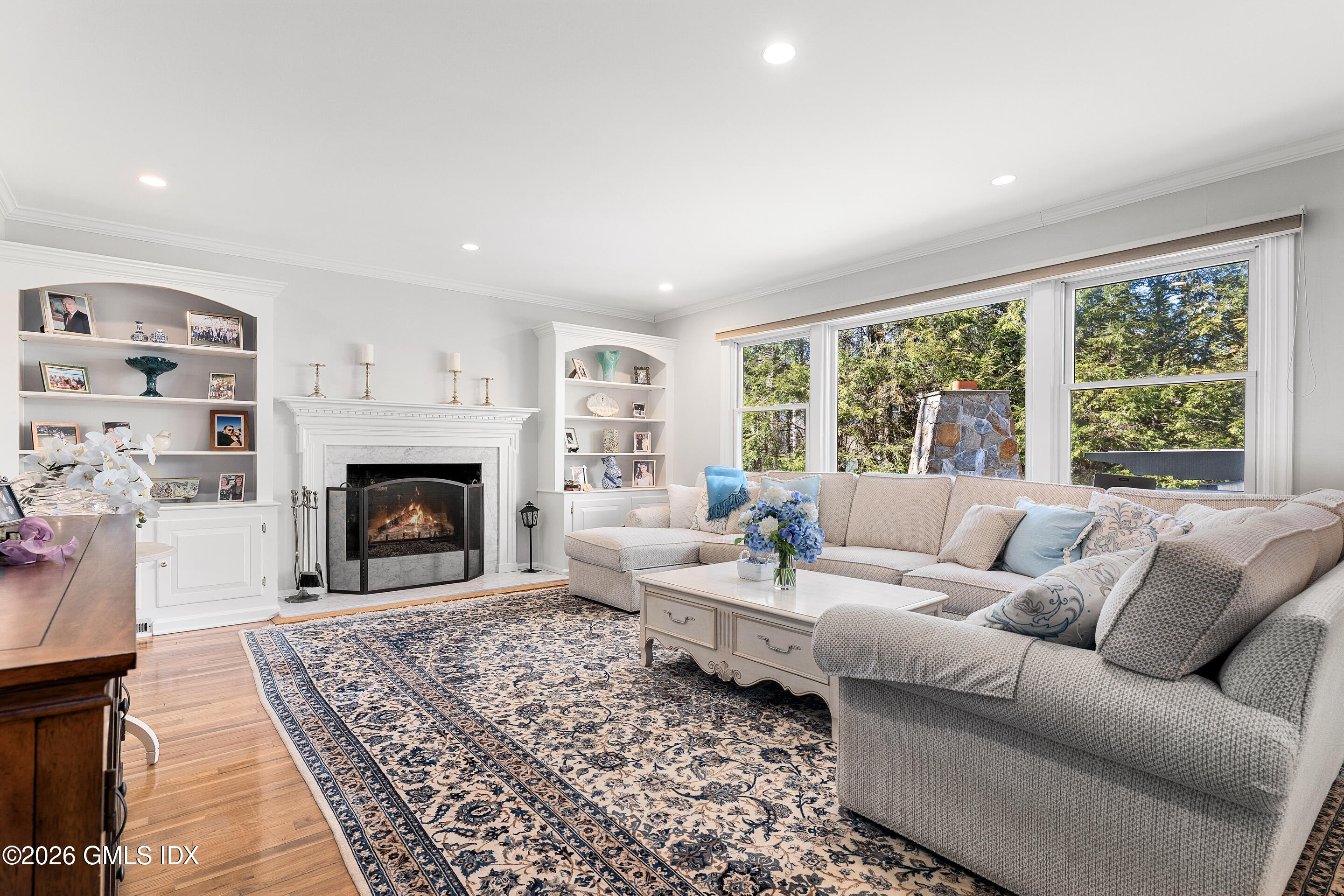 78 Meadow Road Riverside, CT 06878 - Photo 7 of 17 a living room with furniture and a fireplace