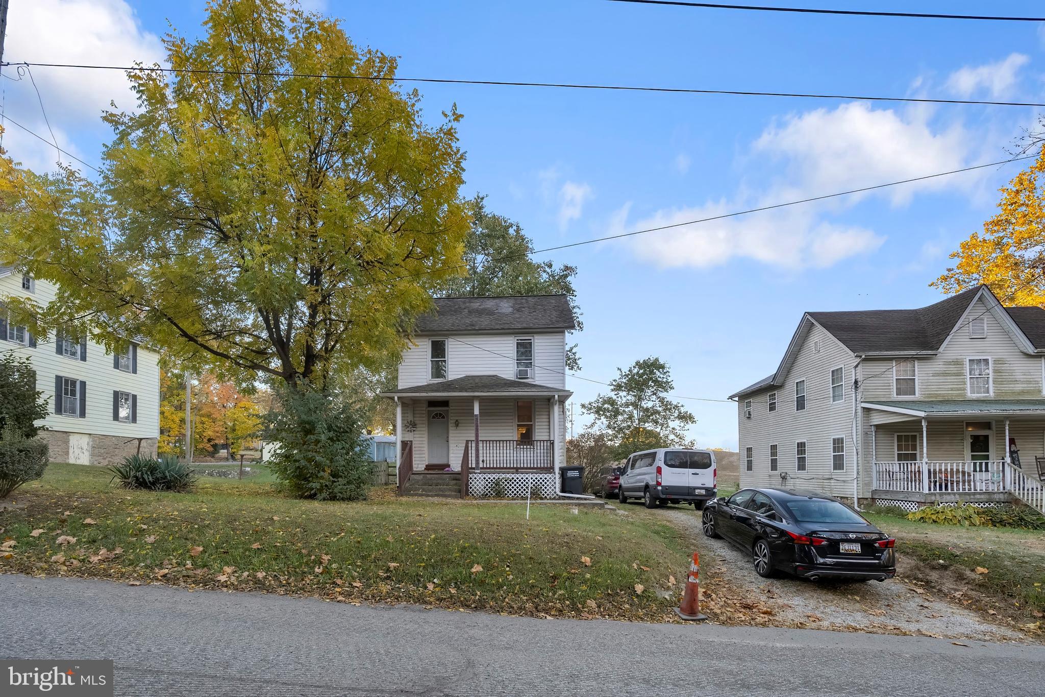 a car parked in front of a brick house