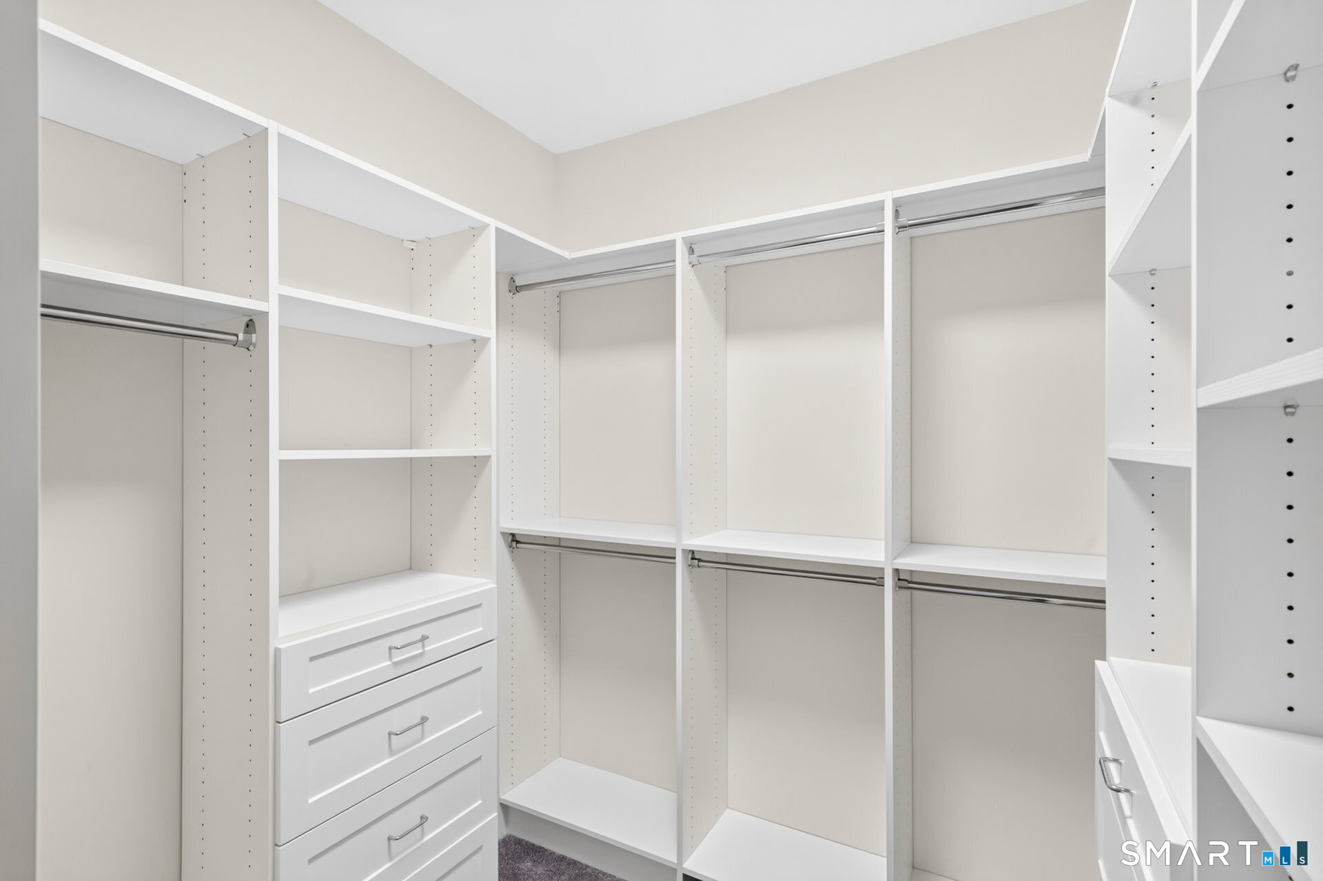 6 Prospect Ridge, Unit 6 Simsbury, CT 06070 - Photo 21 of 33 A spacious walk-in closet/dressing room completes the primary bedroom suite