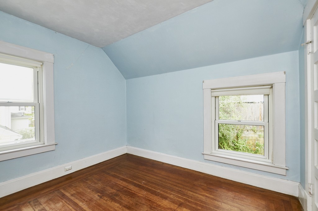 1146 Chestnut Street Newton, MA 02464 - Photo 12 of 19 an empty room with wooden floor and windows