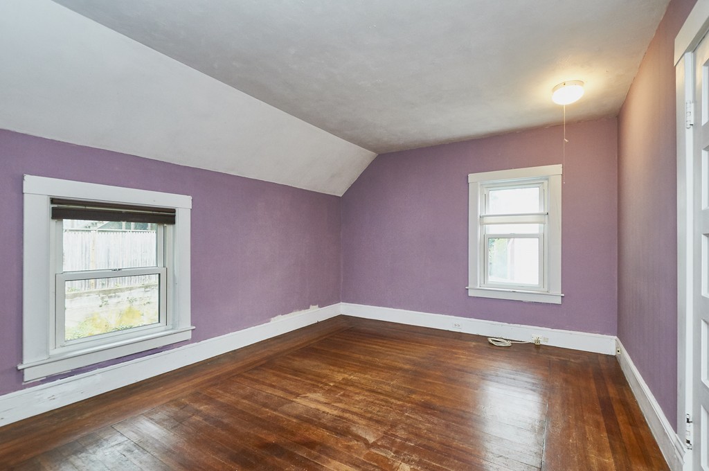 1146 Chestnut Street Newton, MA 02464 - Photo 13 of 19 an empty room with wooden floor and windows