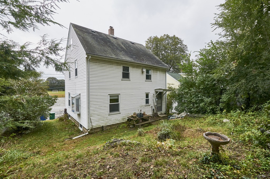 1146 Chestnut Street Newton, MA 02464 - Photo 17 of 19 a backyard of a house with yard and outdoor seating