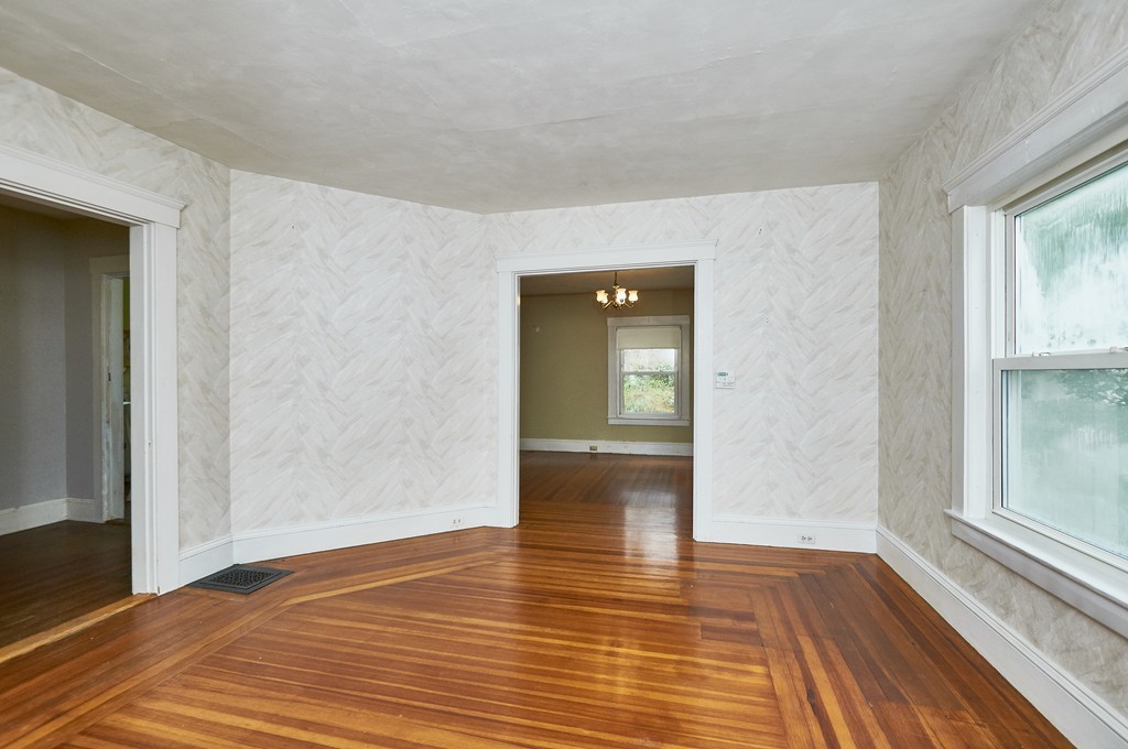 1146 Chestnut Street Newton, MA 02464 - Photo 5 of 19 a view of empty room with wooden floor and fan