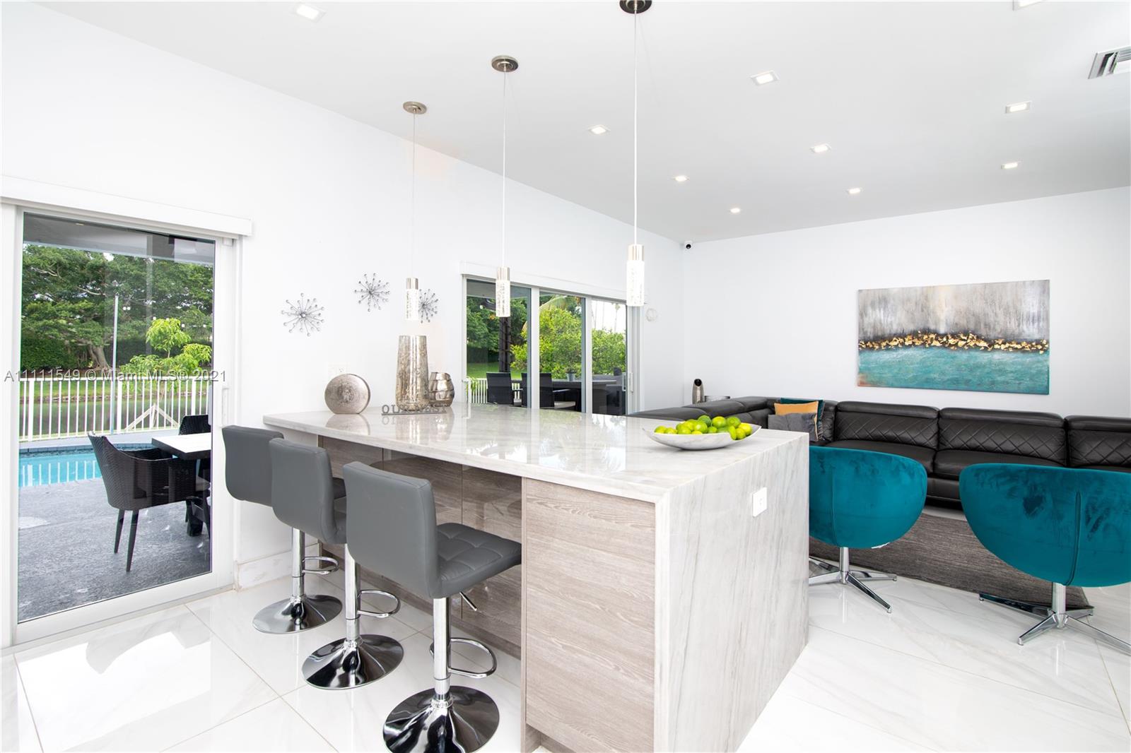 12099 Rockwell Way Boca Raton, FL 33428 - Photo 11 of 60 a kitchen with a dining table chairs and window