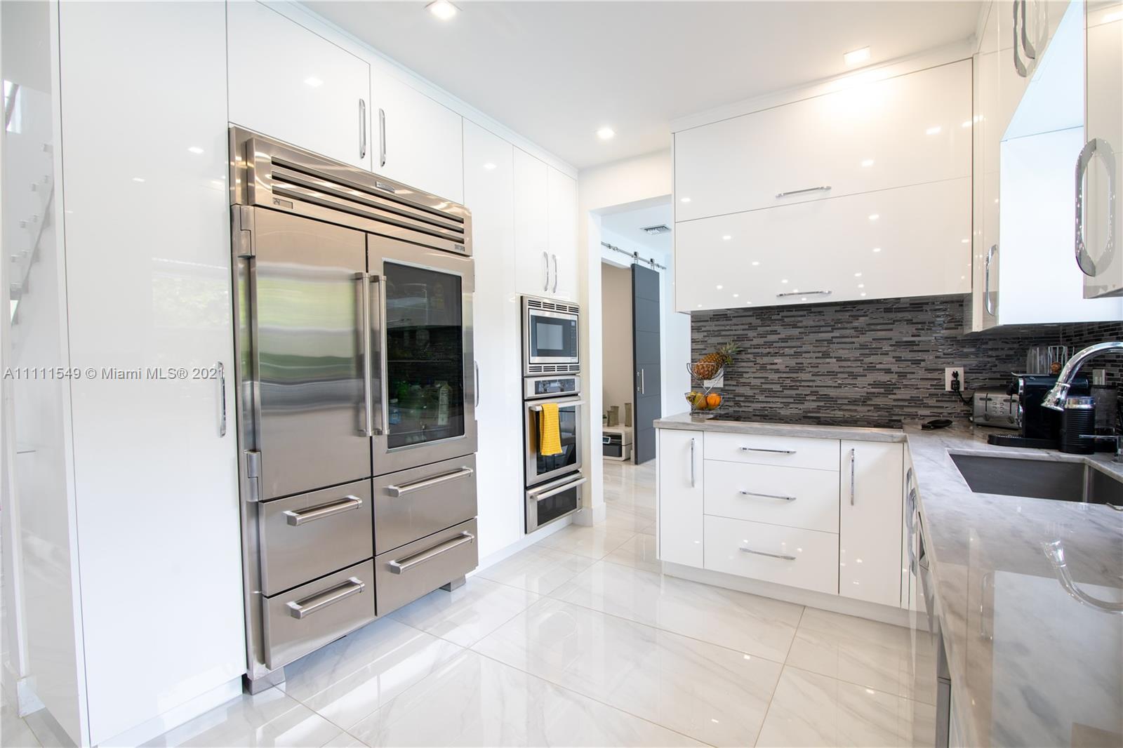 12099 Rockwell Way Boca Raton, FL 33428 - Photo 15 of 60 a kitchen with granite countertop cabinets and appliances