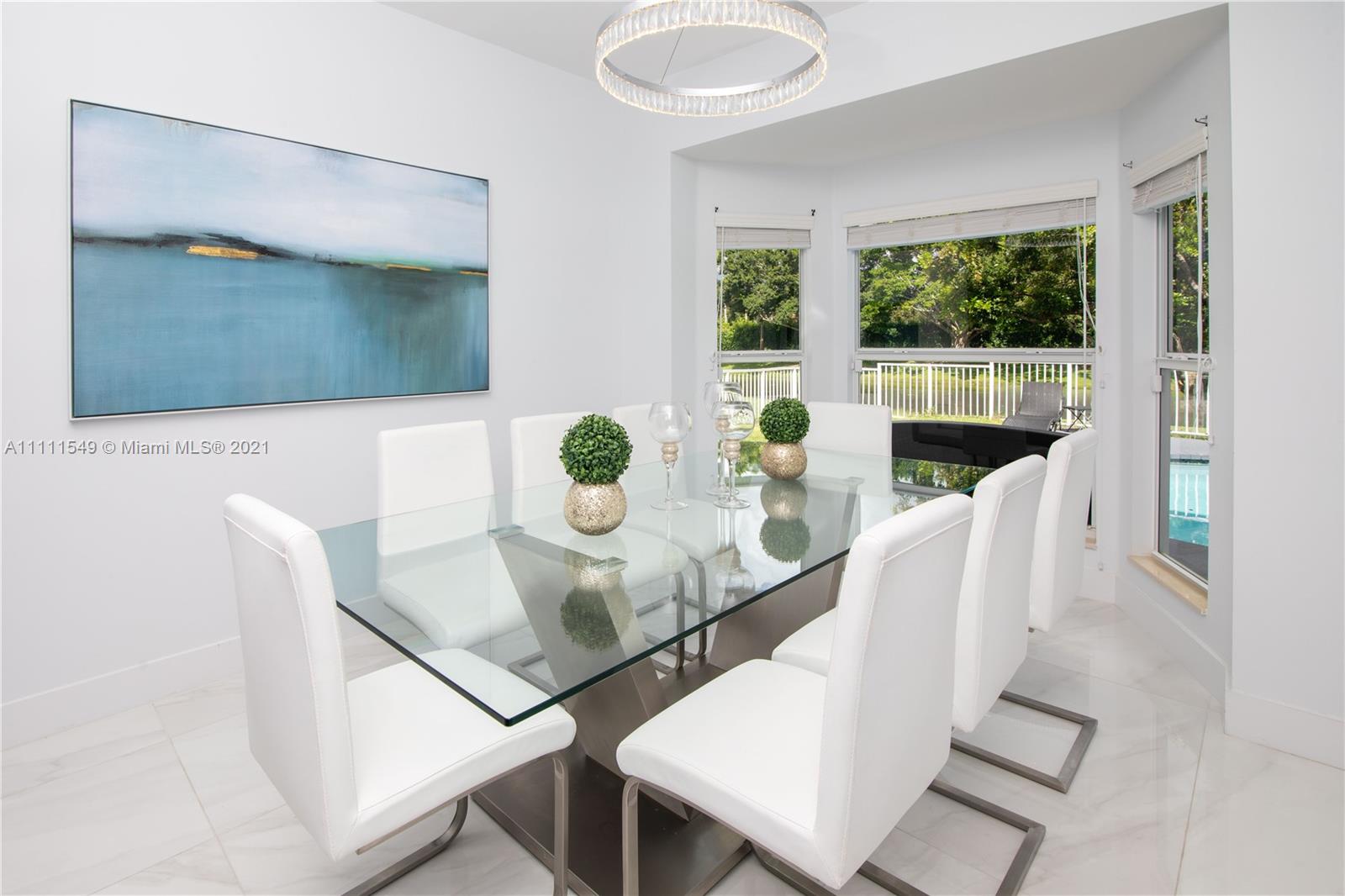 12099 Rockwell Way Boca Raton, FL 33428 - Photo 16 of 60 a dining room with furniture and window