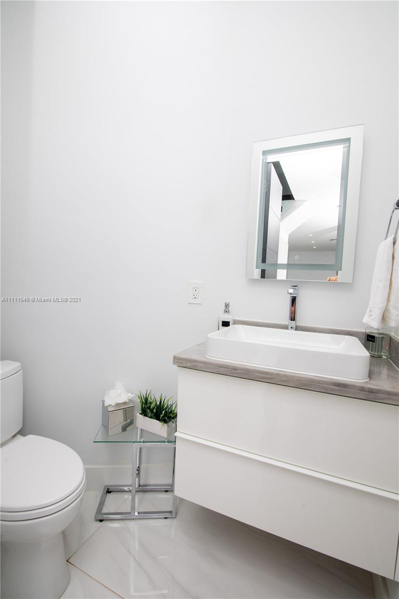 12099 Rockwell Way Boca Raton, FL 33428 - Photo 20 of 60 a bathroom with a sink and a toilet