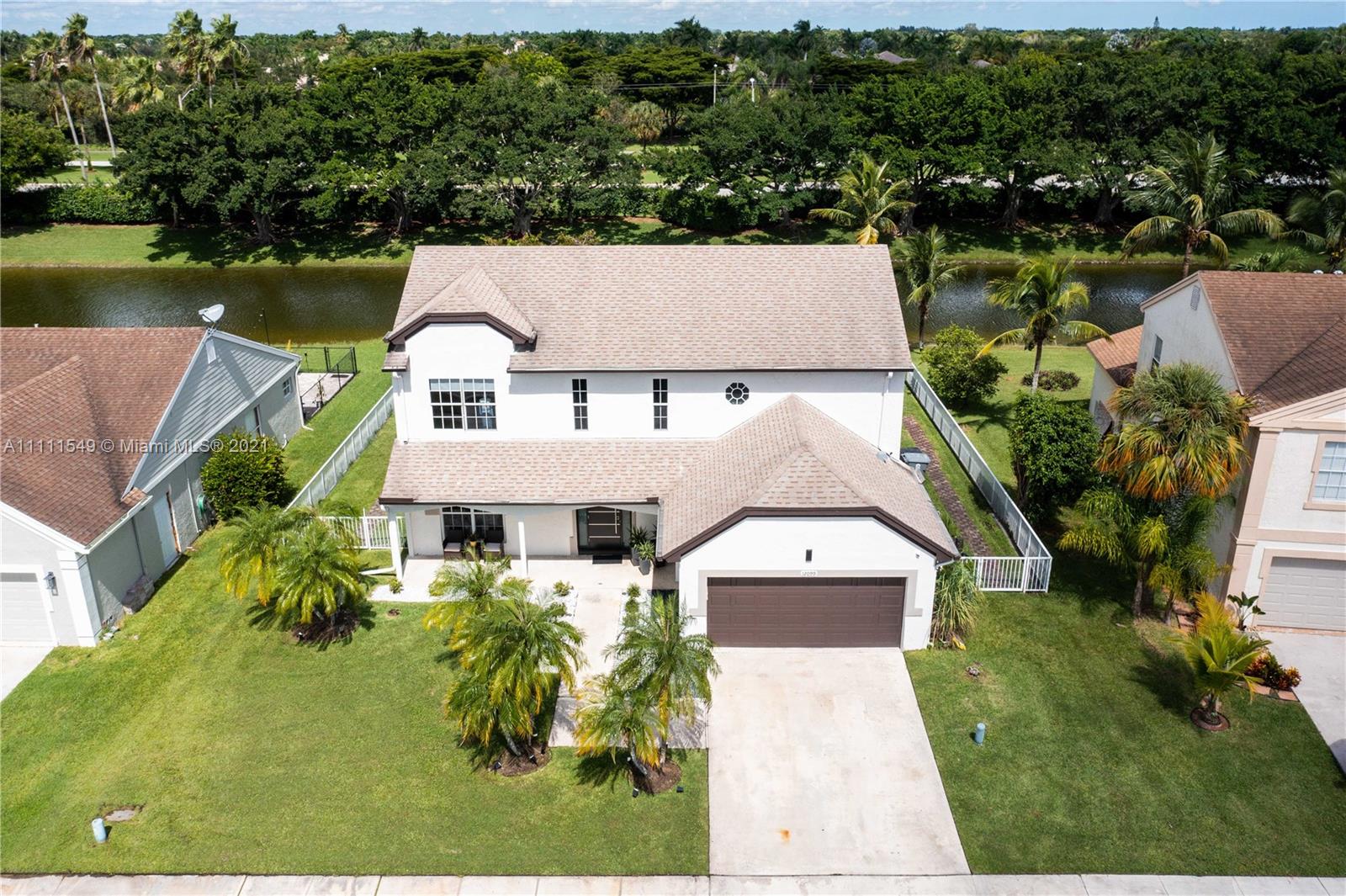 12099 Rockwell Way Boca Raton, FL 33428 - Photo 3 of 60 an aerial view of a house with a lake view