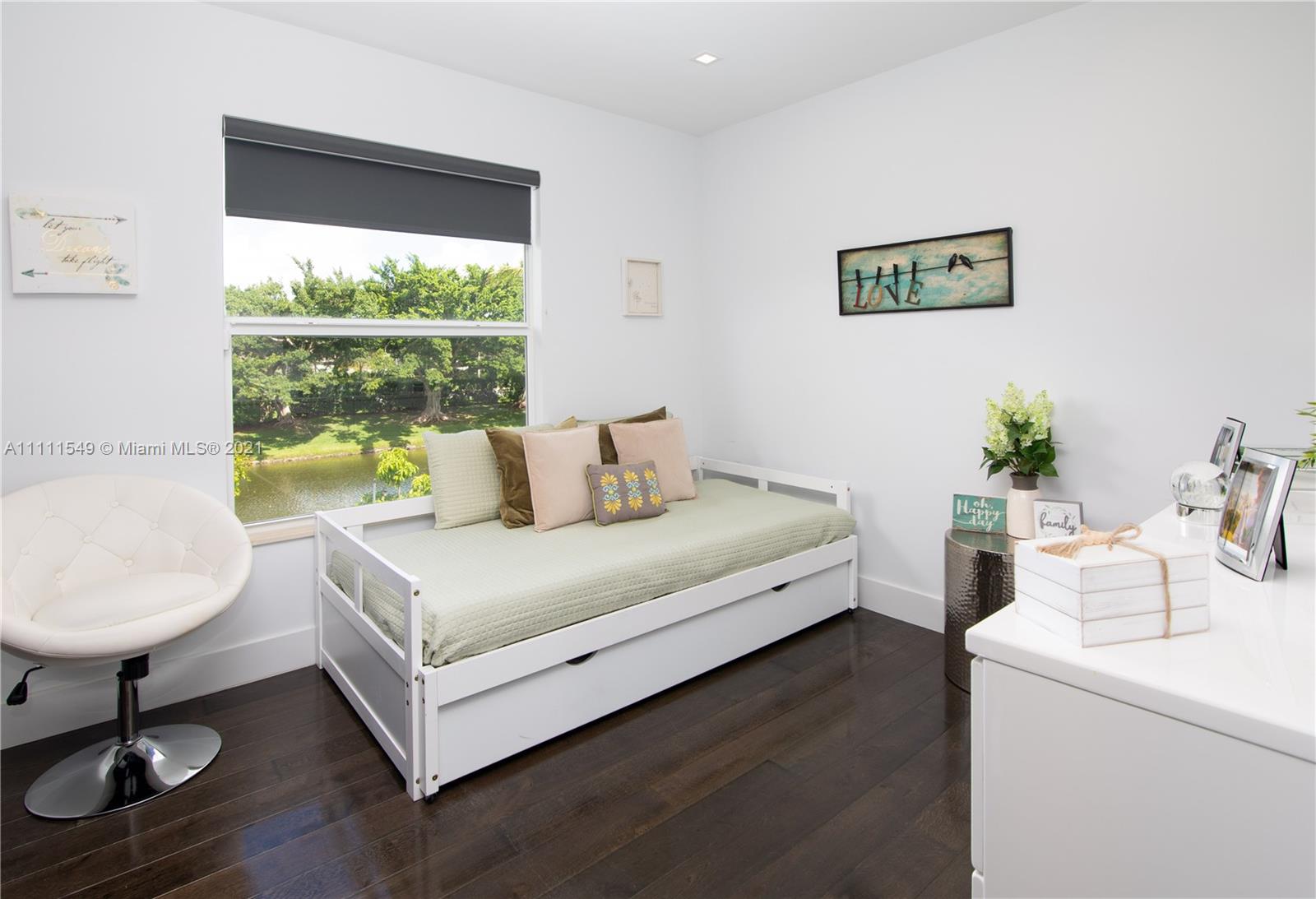 12099 Rockwell Way Boca Raton, FL 33428 - Photo 27 of 60 a bedroom with a bed and a table