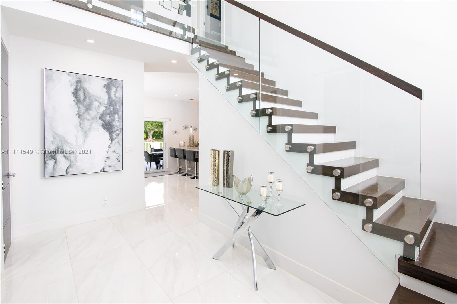 12099 Rockwell Way Boca Raton, FL 33428 - Photo 4 of 60 a view of entryway and hall