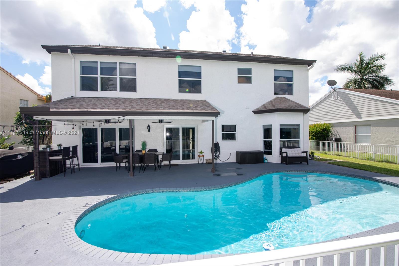 12099 Rockwell Way Boca Raton, FL 33428 - Photo 36 of 60 a view of a house with swimming pool and sitting area