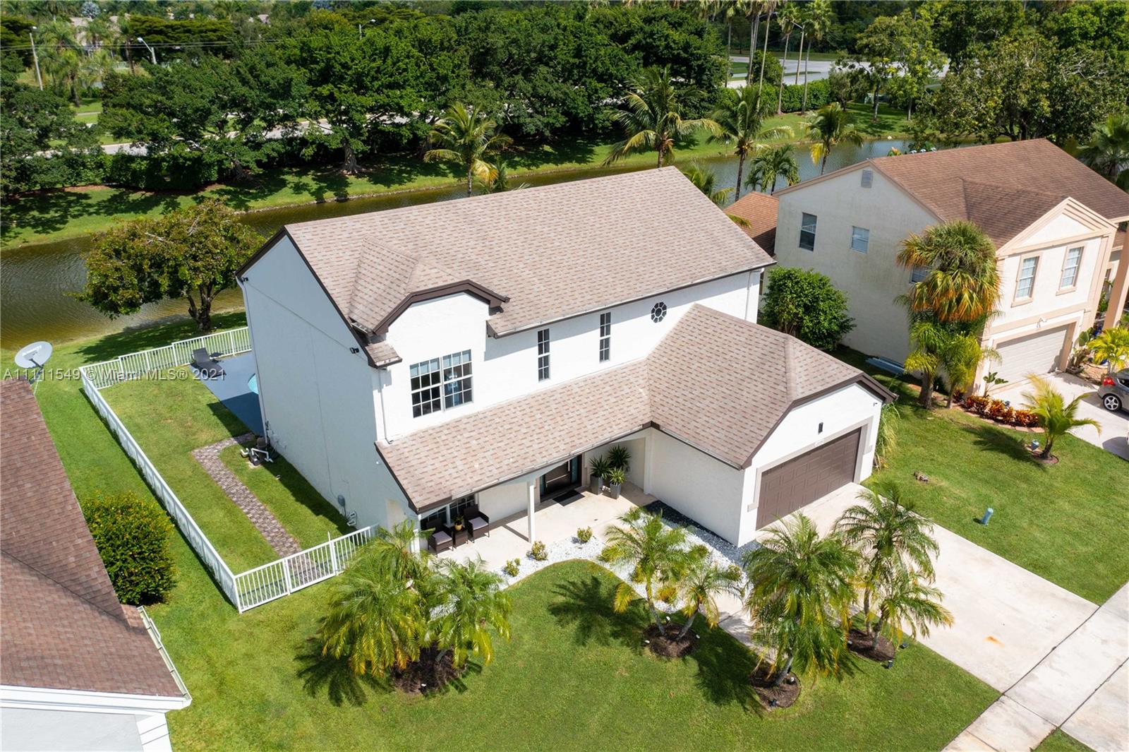 12099 Rockwell Way Boca Raton, FL 33428 - Photo 47 of 60 an aerial view of a house with a garden and plants