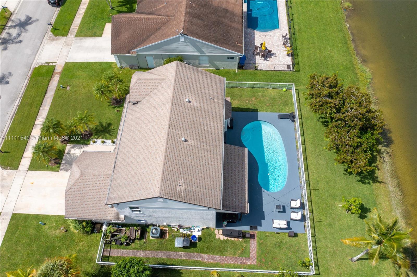 12099 Rockwell Way Boca Raton, FL 33428 - Photo 48 of 60 an aerial view of a house with a yard swimming pool and outdoor seating