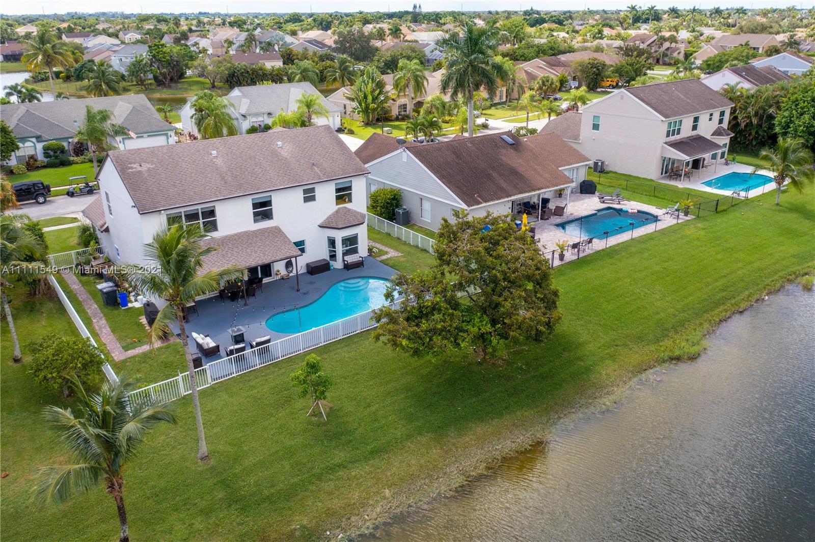 12099 Rockwell Way Boca Raton, FL 33428 - Photo 53 of 60 an aerial view of residential houses with outdoor space and trees