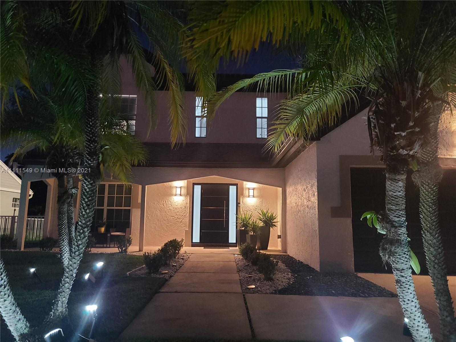 12099 Rockwell Way Boca Raton, FL 33428 - Photo 59 of 60 a view of backyard with plants and outdoor seating