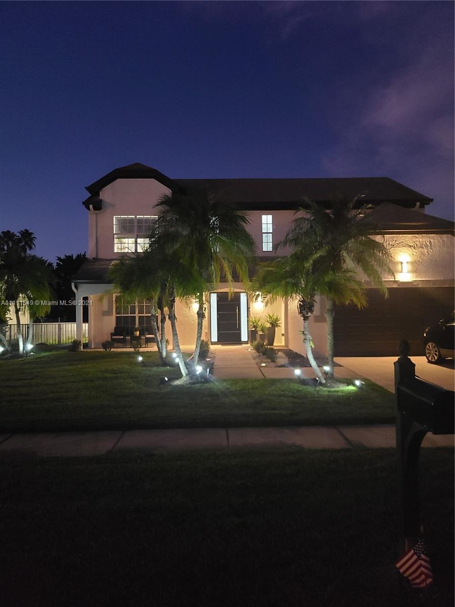 12099 Rockwell Way Boca Raton, FL 33428 - Photo 60 of 60 a front view of a house with a yard