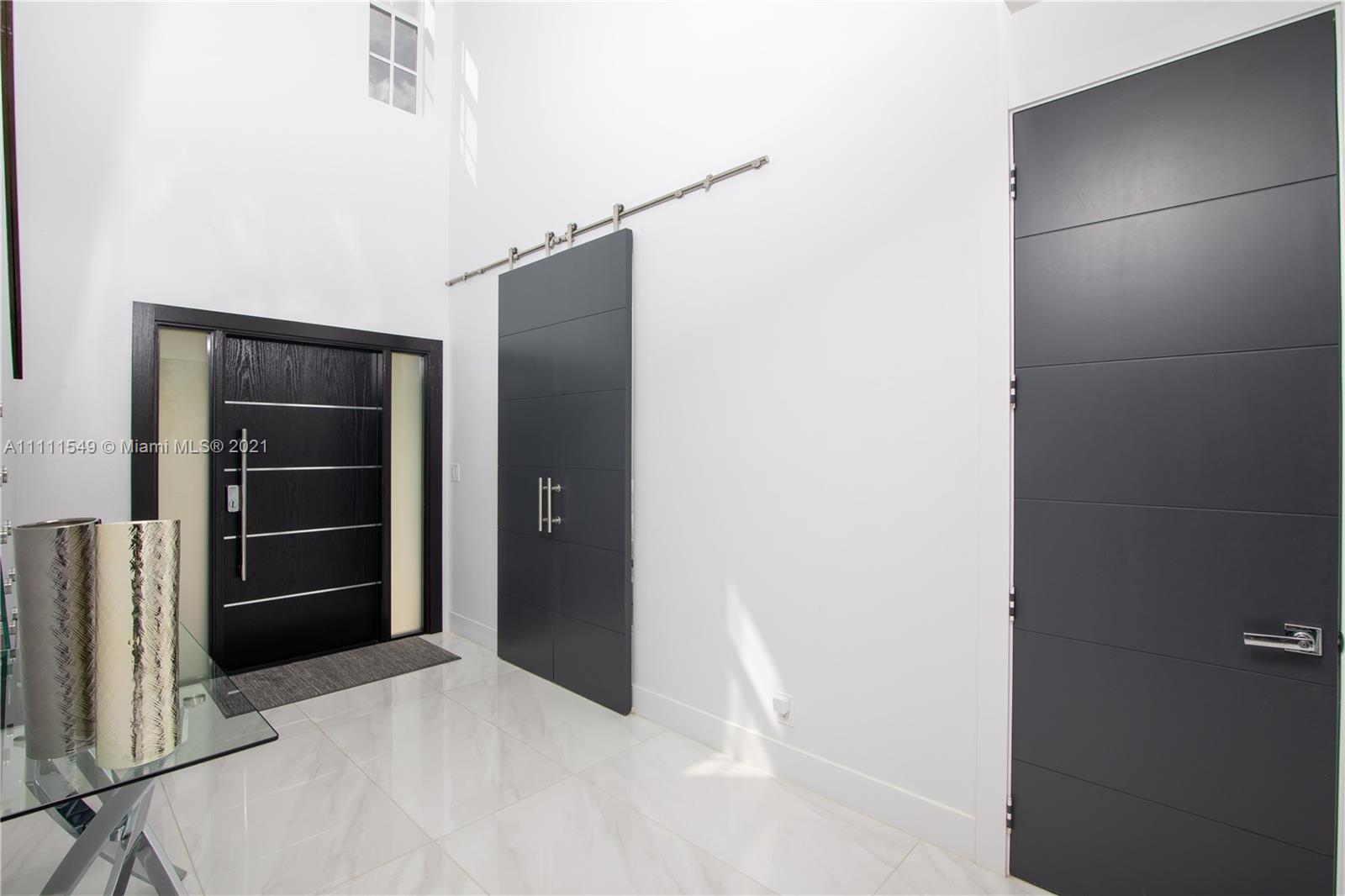 12099 Rockwell Way Boca Raton, FL 33428 - Photo 7 of 60 a view of an empty room with a cabinet