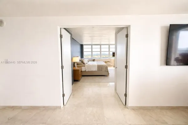 a view of a living room with furniture and a window