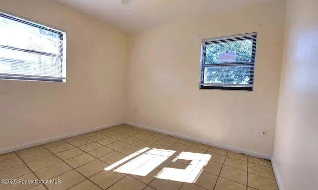 an empty room with windows