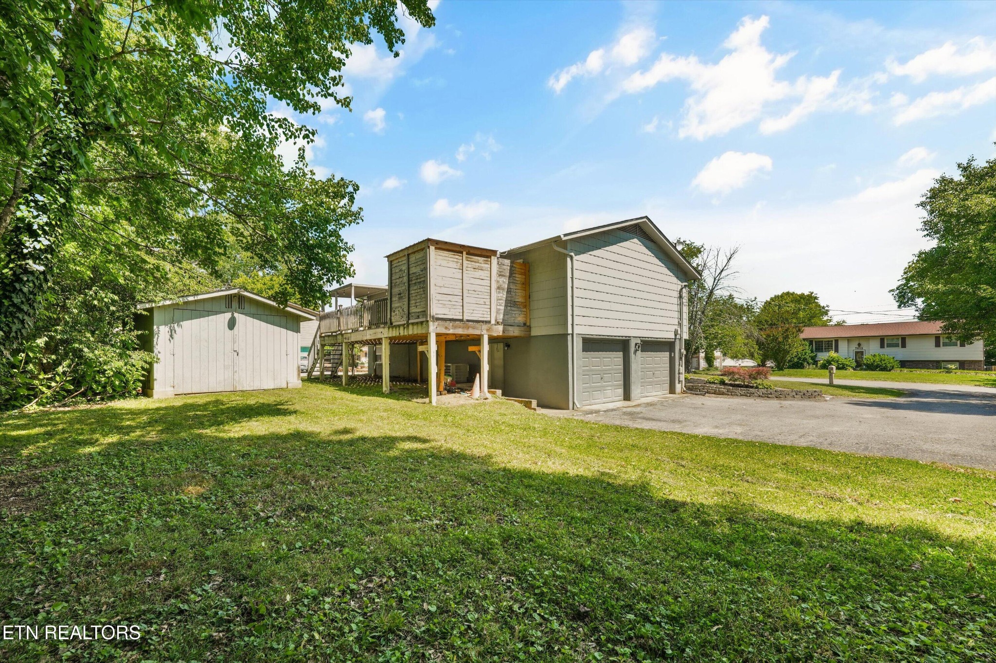 7613 Fall Wind Court Powell, TN 37849 - Photo 32 of 38 a front view of a house with a yard and garage