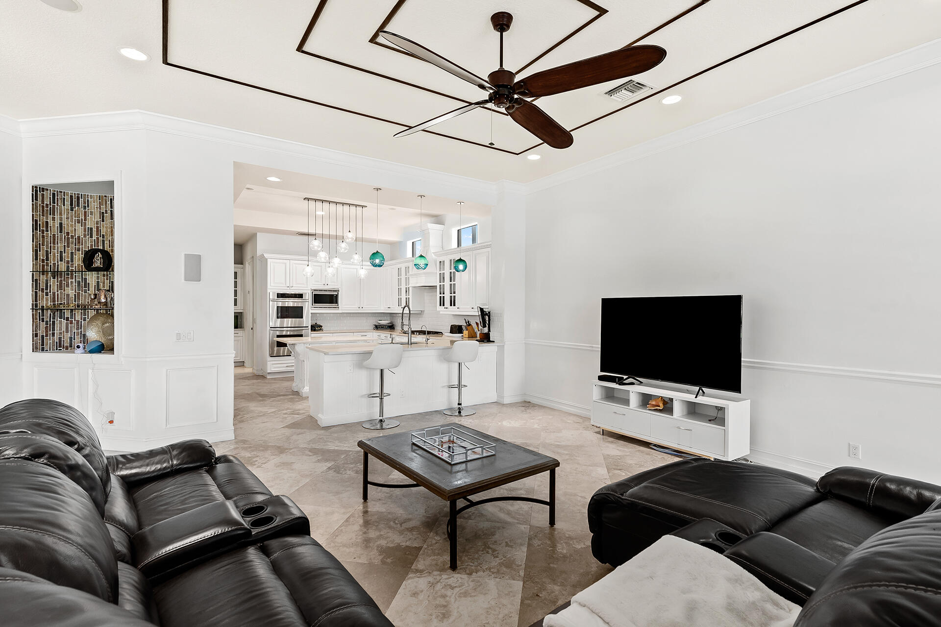 9455 Bridgebrook Drive Boca Raton, FL 33496 - Photo 18 of 63 a living room with furniture and a flat screen tv