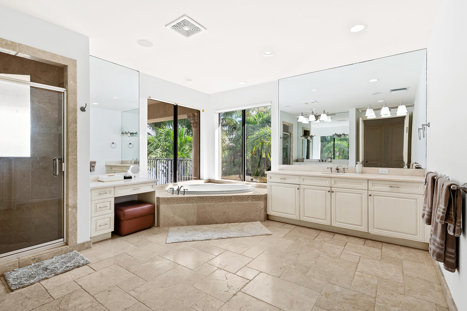 9455 Bridgebrook Drive Boca Raton, FL 33496 - Photo 27 of 63 a large white bathroom with a large tub shower and sink