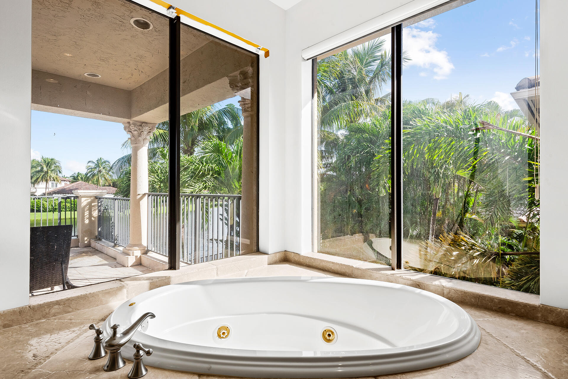 9455 Bridgebrook Drive Boca Raton, FL 33496 - Photo 29 of 63 a bathroom with a tub and window