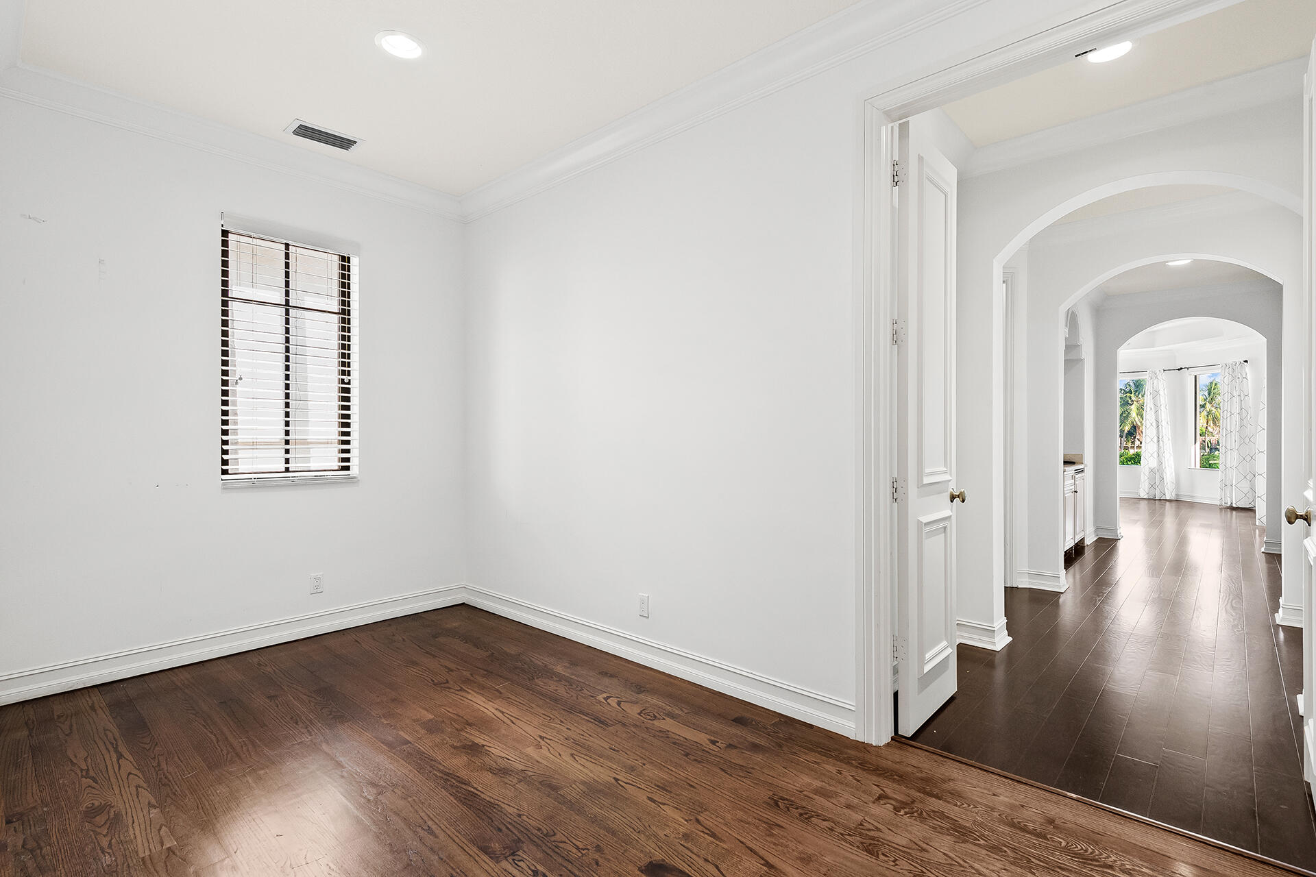 9455 Bridgebrook Drive Boca Raton, FL 33496 - Photo 30 of 63 wooden floor in an empty room with a window