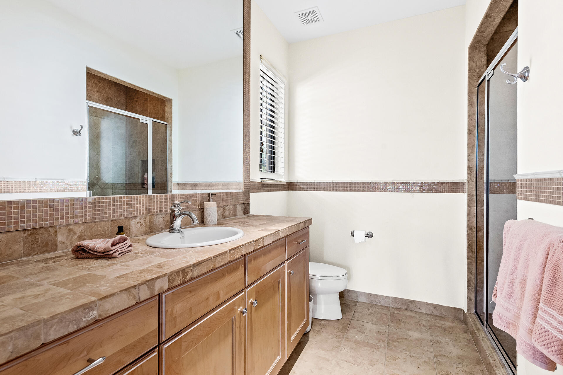 9455 Bridgebrook Drive Boca Raton, FL 33496 - Photo 34 of 63 a bathroom with a granite countertop sink and a mirror