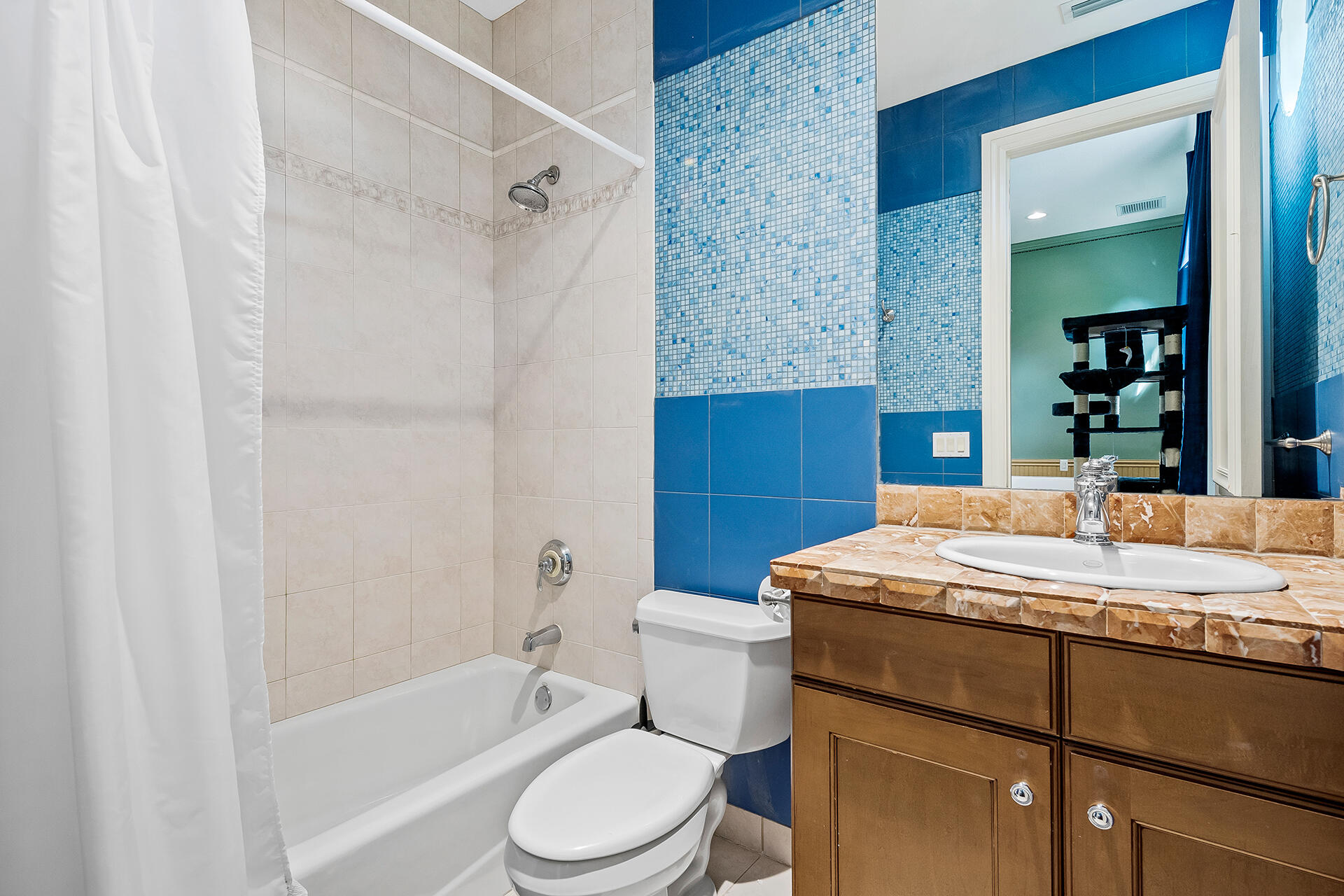 9455 Bridgebrook Drive Boca Raton, FL 33496 - Photo 38 of 63 a bathroom with a sink a toilet a mirror and bathtub