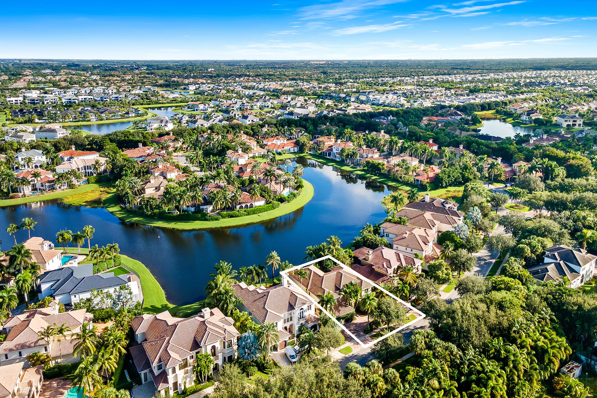 9455 Bridgebrook Drive Boca Raton, FL 33496 - Photo 4 of 63 an aerial view of a houses with a lake