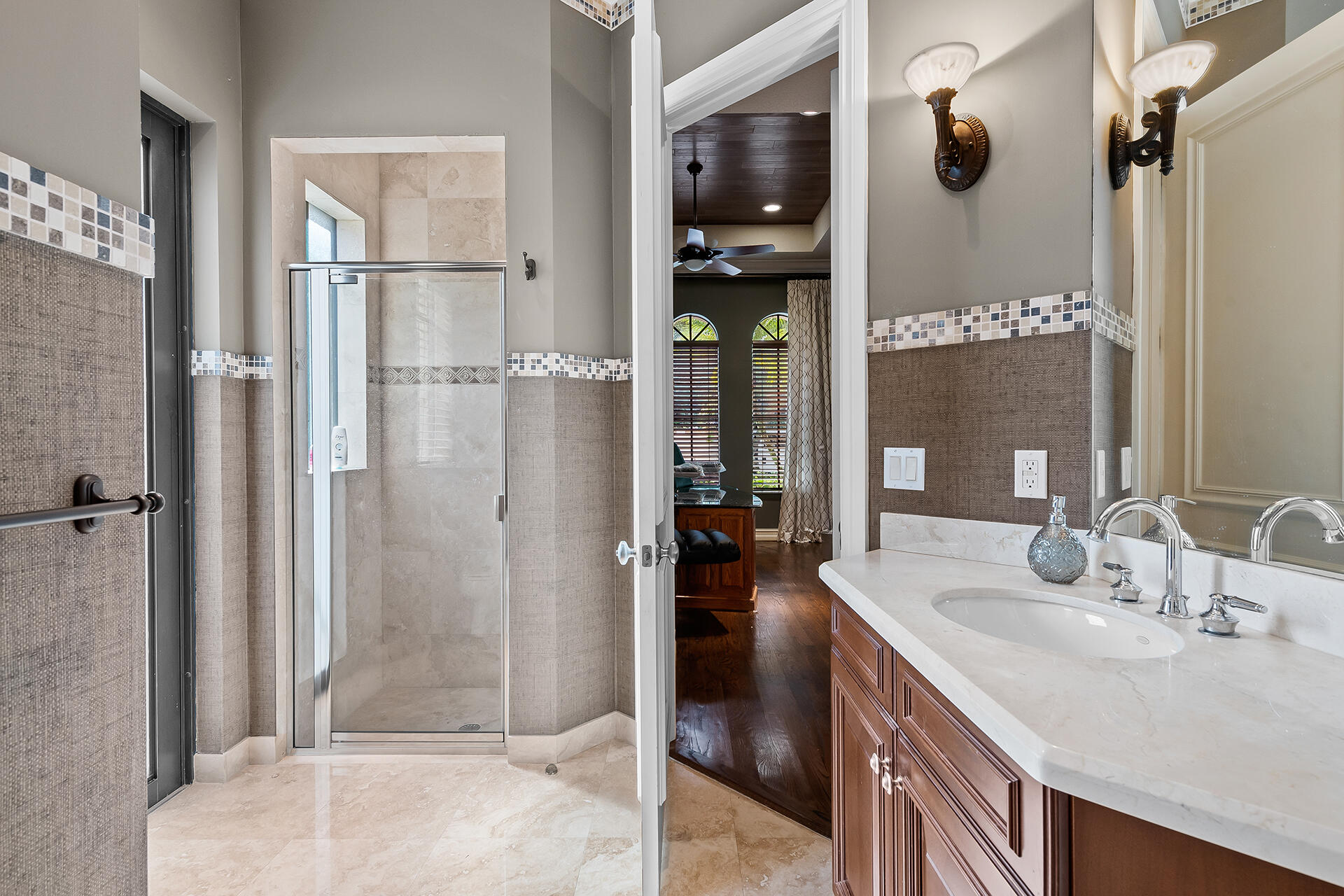 9455 Bridgebrook Drive Boca Raton, FL 33496 - Photo 43 of 63 a bathroom with a sink and a mirror