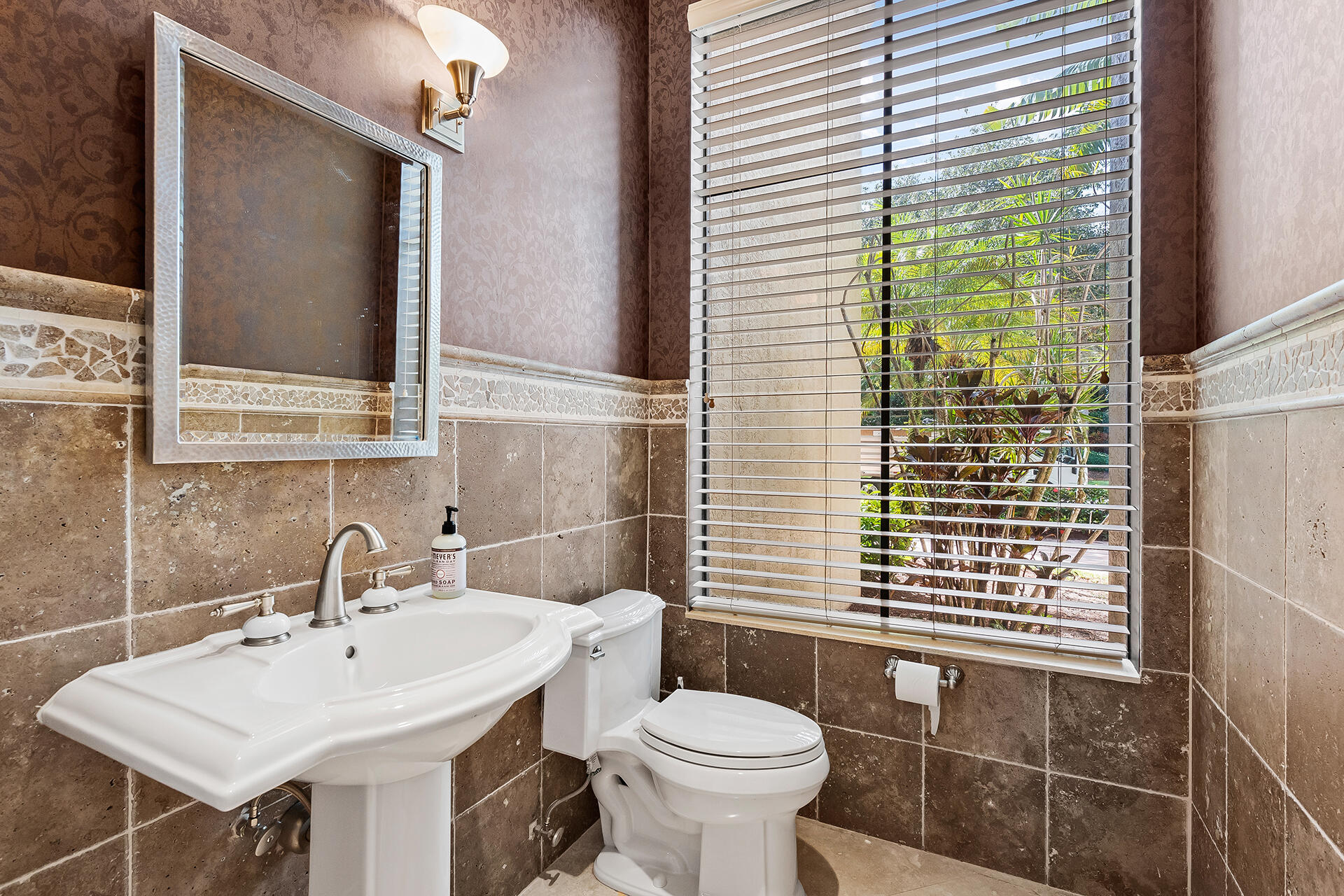 9455 Bridgebrook Drive Boca Raton, FL 33496 - Photo 45 of 63 a bathroom with a sink a toilet and mirror