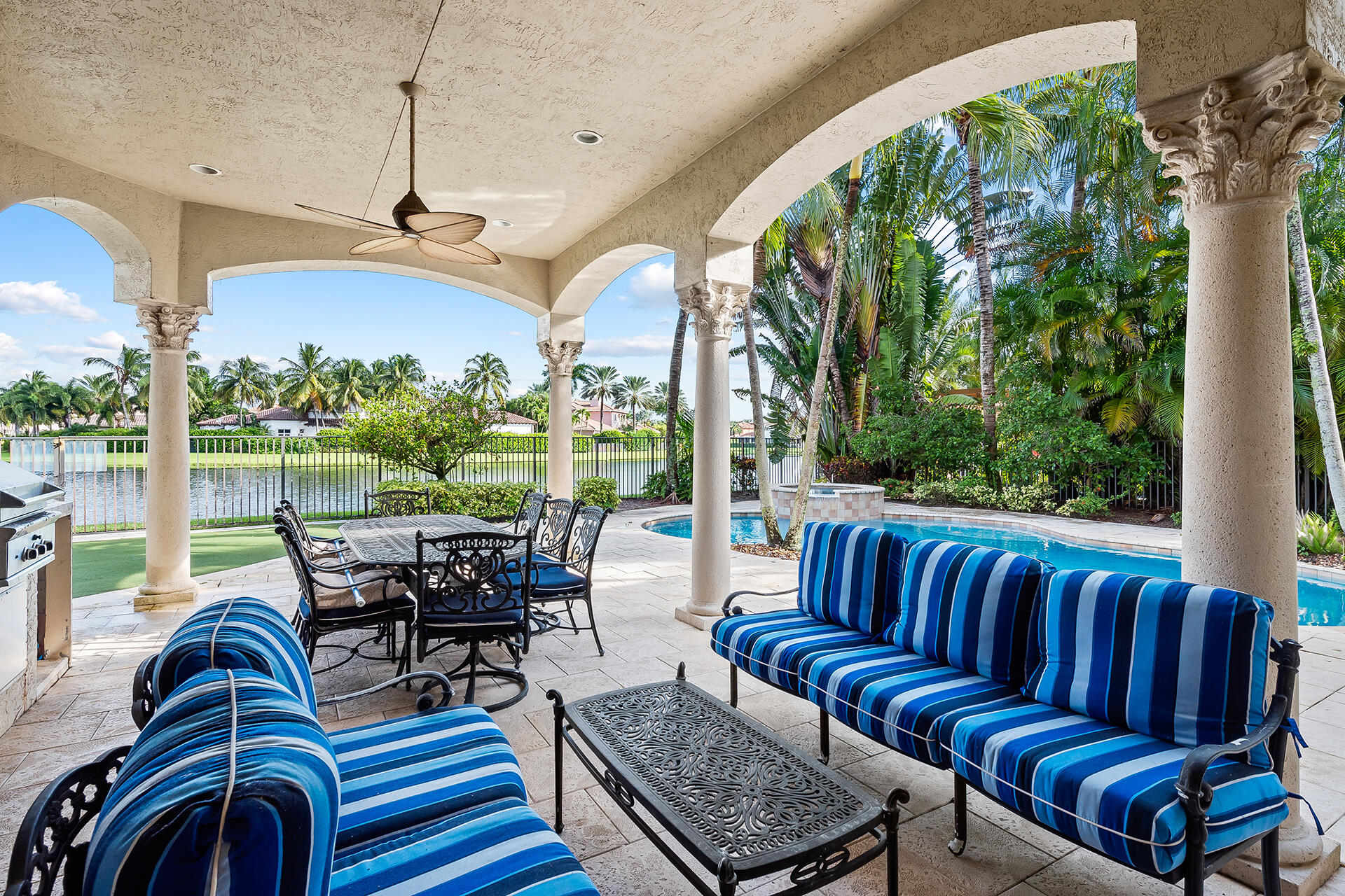9455 Bridgebrook Drive Boca Raton, FL 33496 - Photo 48 of 63 a living room with patio furniture and a floor to ceiling window