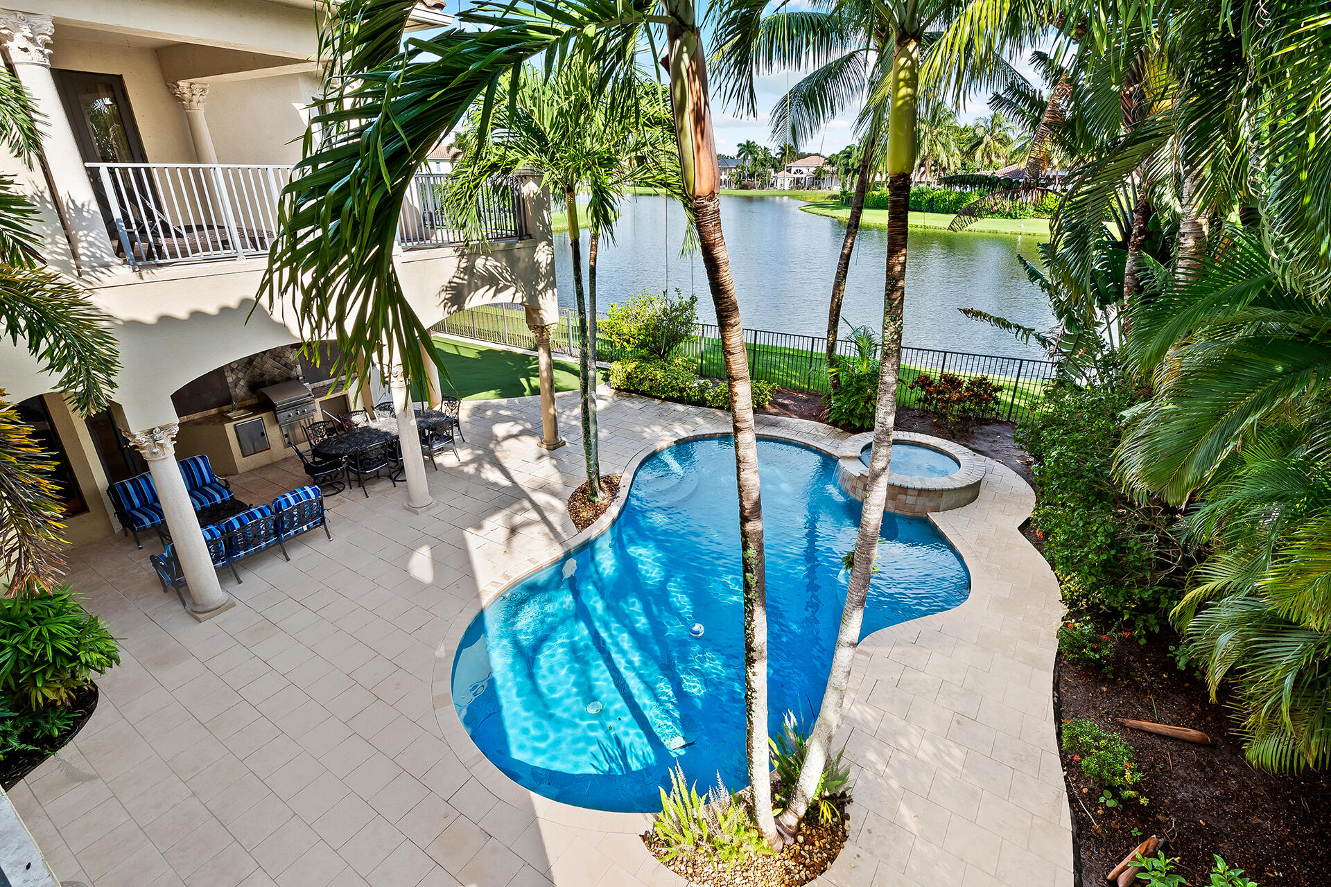 9455 Bridgebrook Drive Boca Raton, FL 33496 - Photo 51 of 63 a view of a backyard with plants and a patio