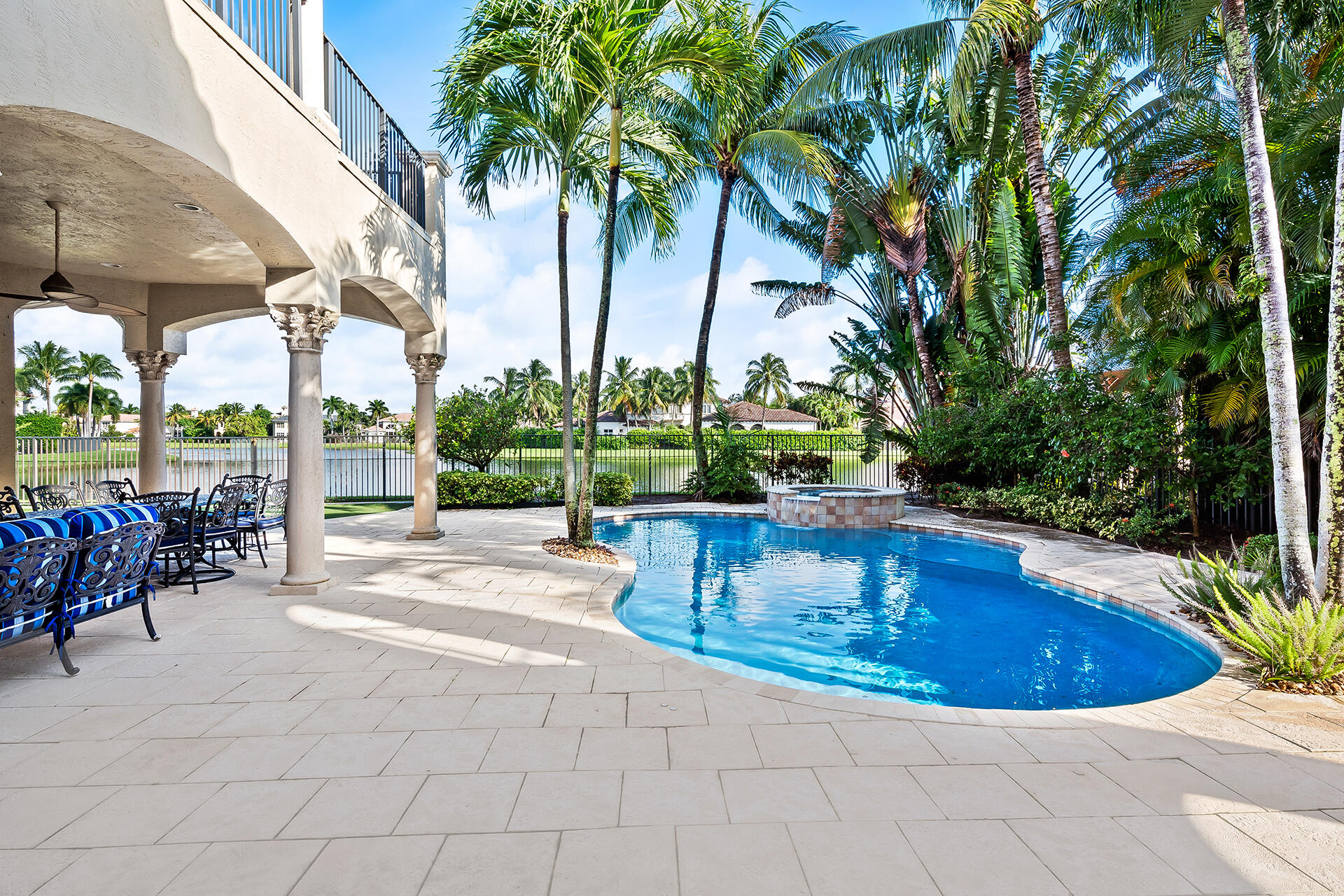 9455 Bridgebrook Drive Boca Raton, FL 33496 - Photo 52 of 63 a view of swimming pool with a table and chairs