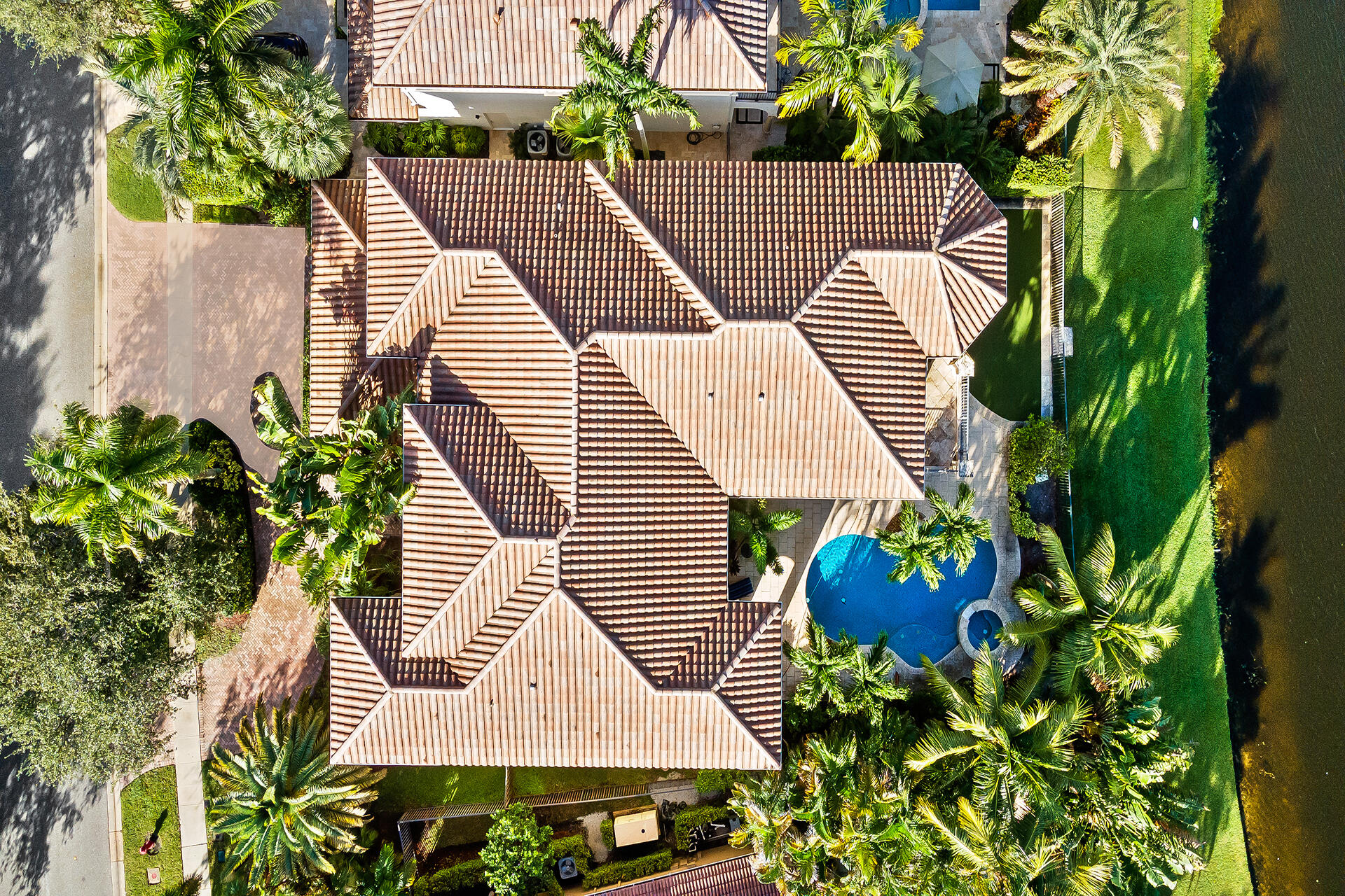 9455 Bridgebrook Drive Boca Raton, FL 33496 - Photo 56 of 63 a aerial view of a house with a yard and potted plants