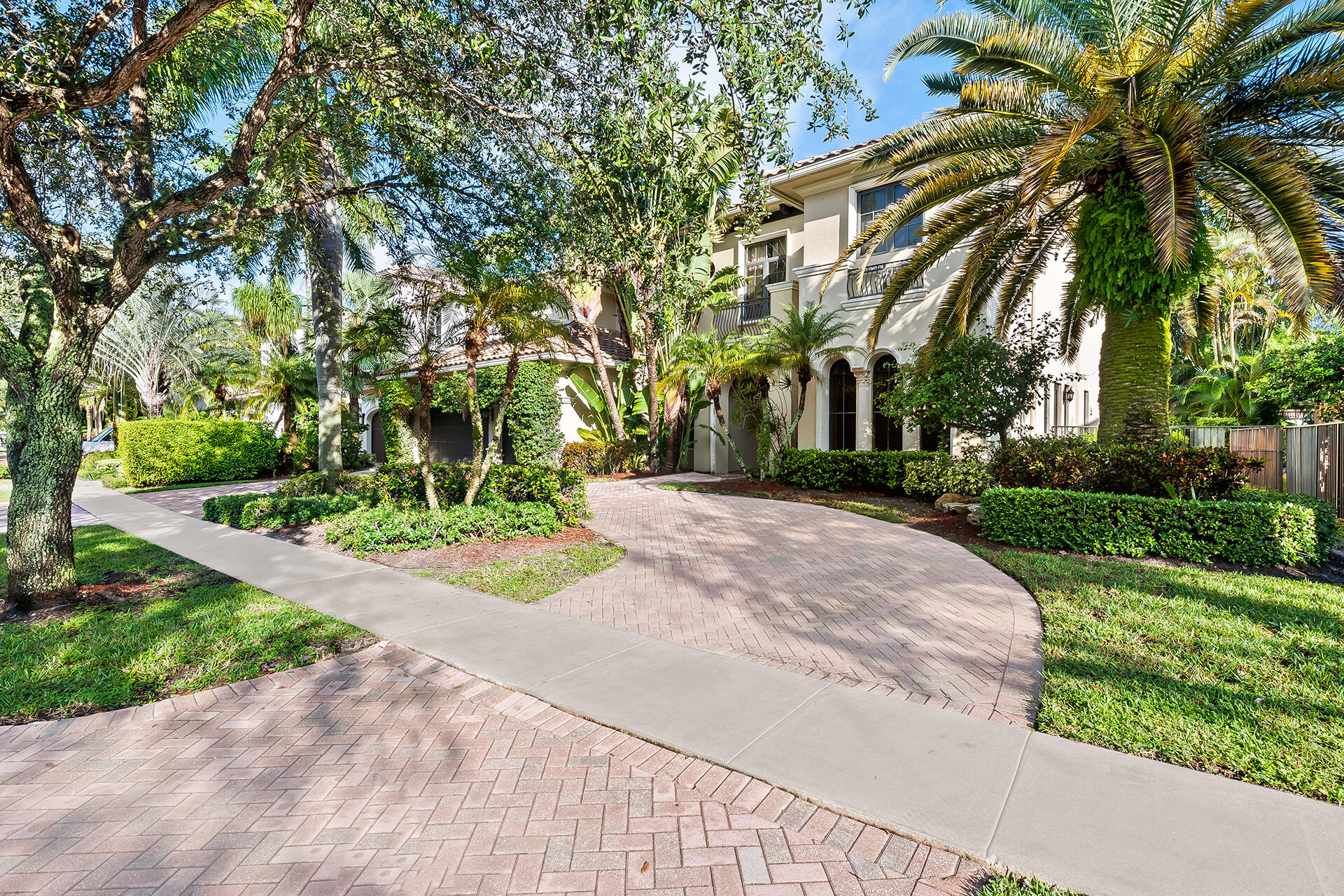 9455 Bridgebrook Drive Boca Raton, FL 33496 - Photo 58 of 63 a view of a backyard with palm trees