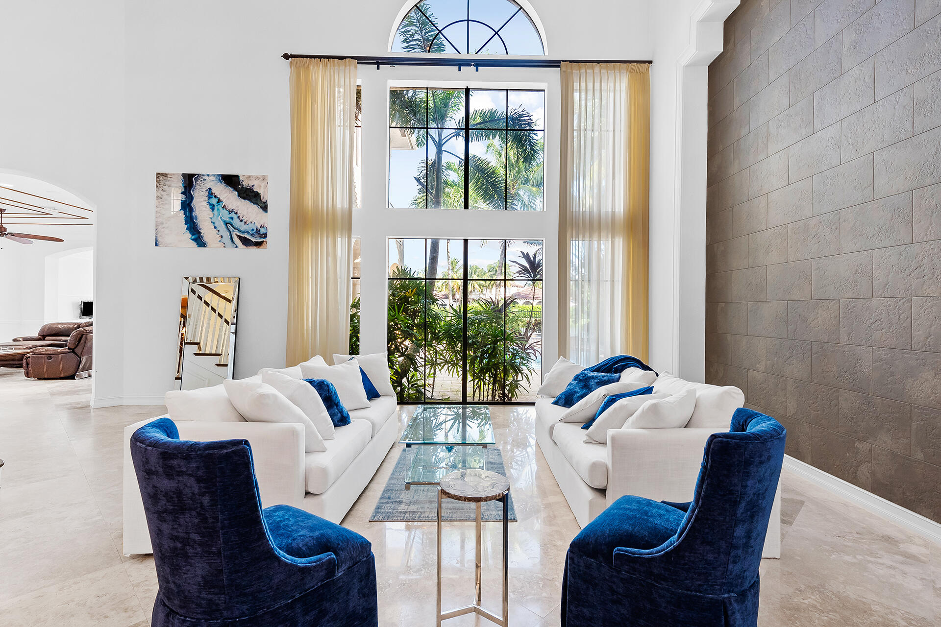 9455 Bridgebrook Drive Boca Raton, FL 33496 - Photo 9 of 63 a living room with furniture and a large window